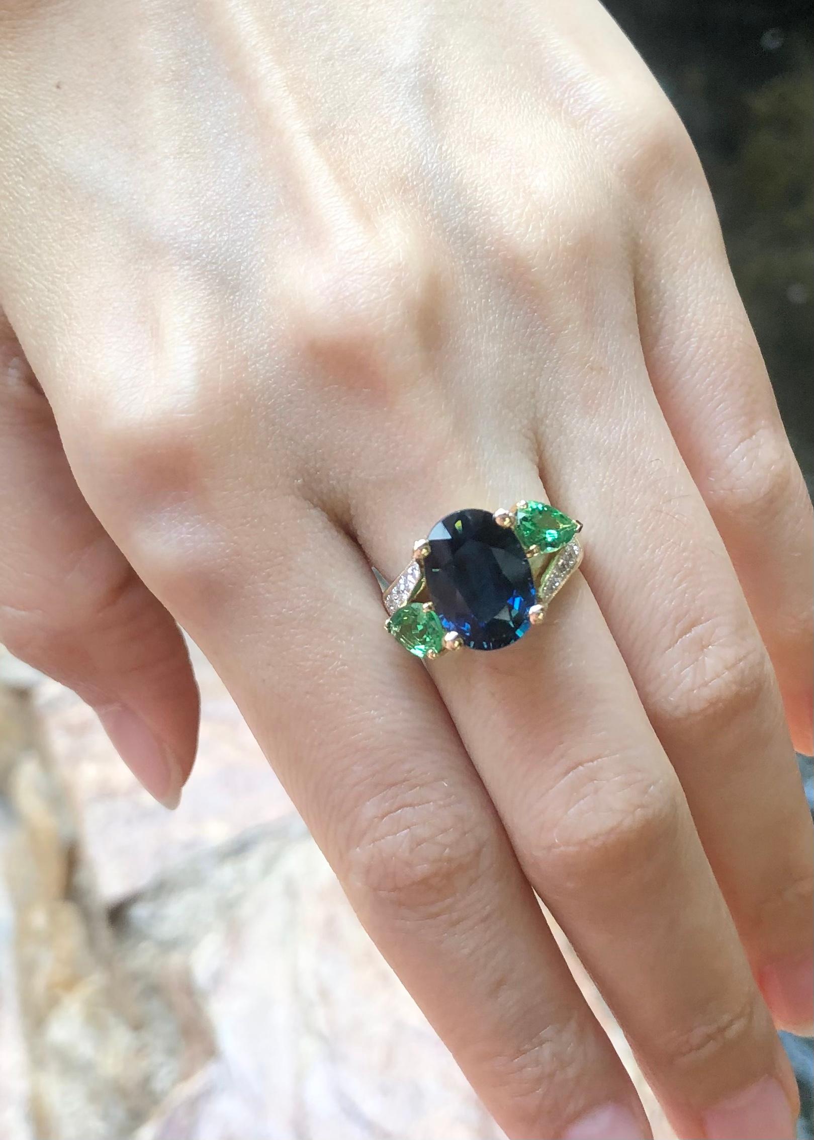Blue Sapphire 5.77 carats, Tsavorite 1.37 carats and Diamond 0.46 carat Ring set in 18K White Gold Settings

Width:  2.0 cm 
Length: 1.2 cm
Ring Size: 51
Total Weight: 7.26 grams

