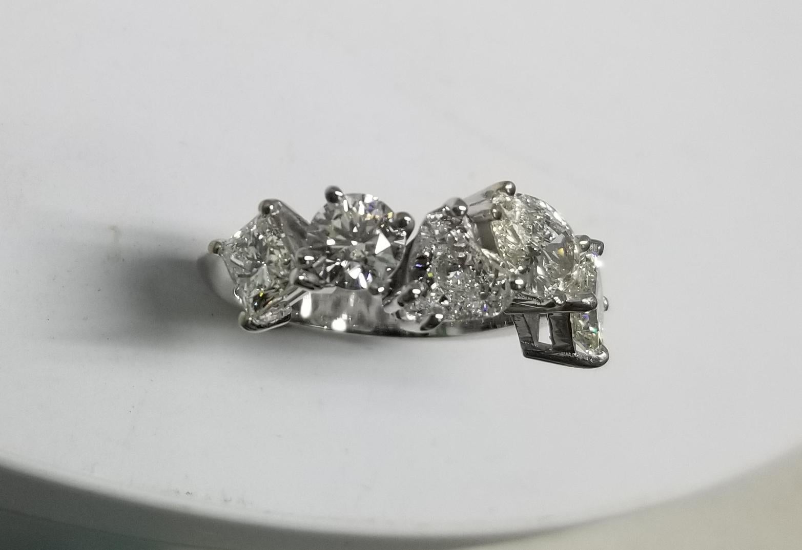 *Motivated to Sell – Please make a Fair Offer*
GIA Certified set in 14k white gold 5 GIA diamonds
Specifications:
Total Carat Weight:  3.17cts.	
Main Stone: 	GIA Radiant cut .57 J VS1
                        GIA Brilliant cut .57 H VS1
             
