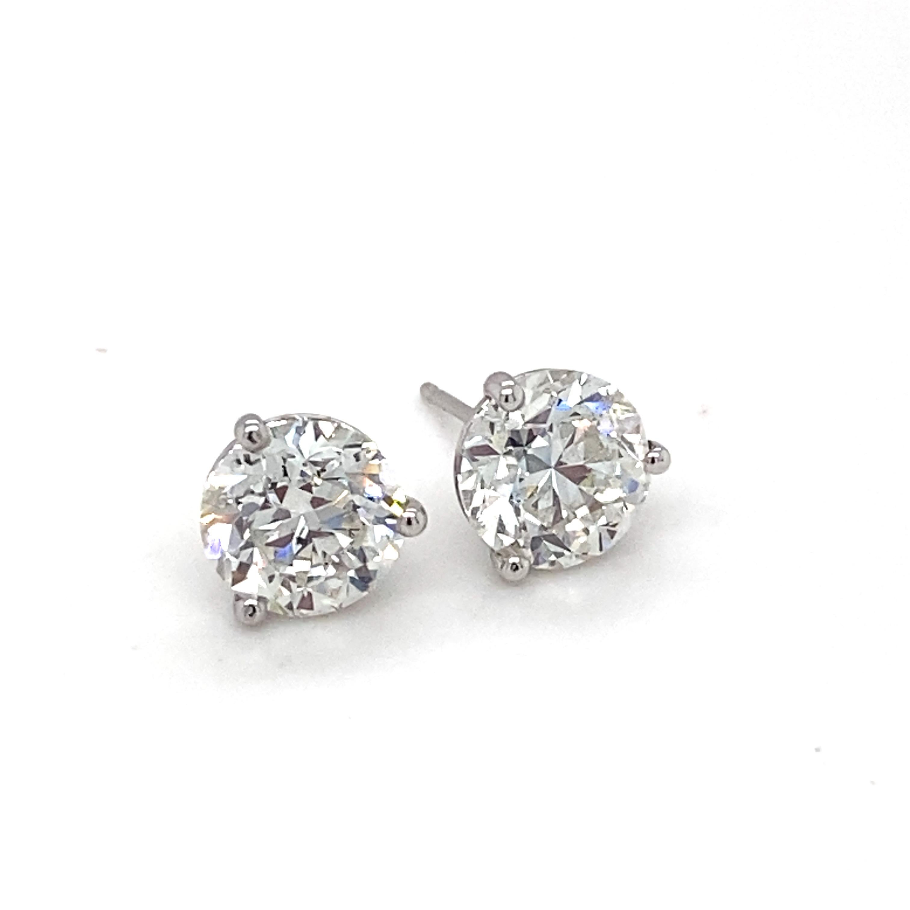 This classic stud earrings showcases GIA Certified 5.00 carat  I color two brilliant cut diamonds. Set in a three prong setting in 18K white gold is a timeless piece of jewelry which can be worn with any style of outfits.