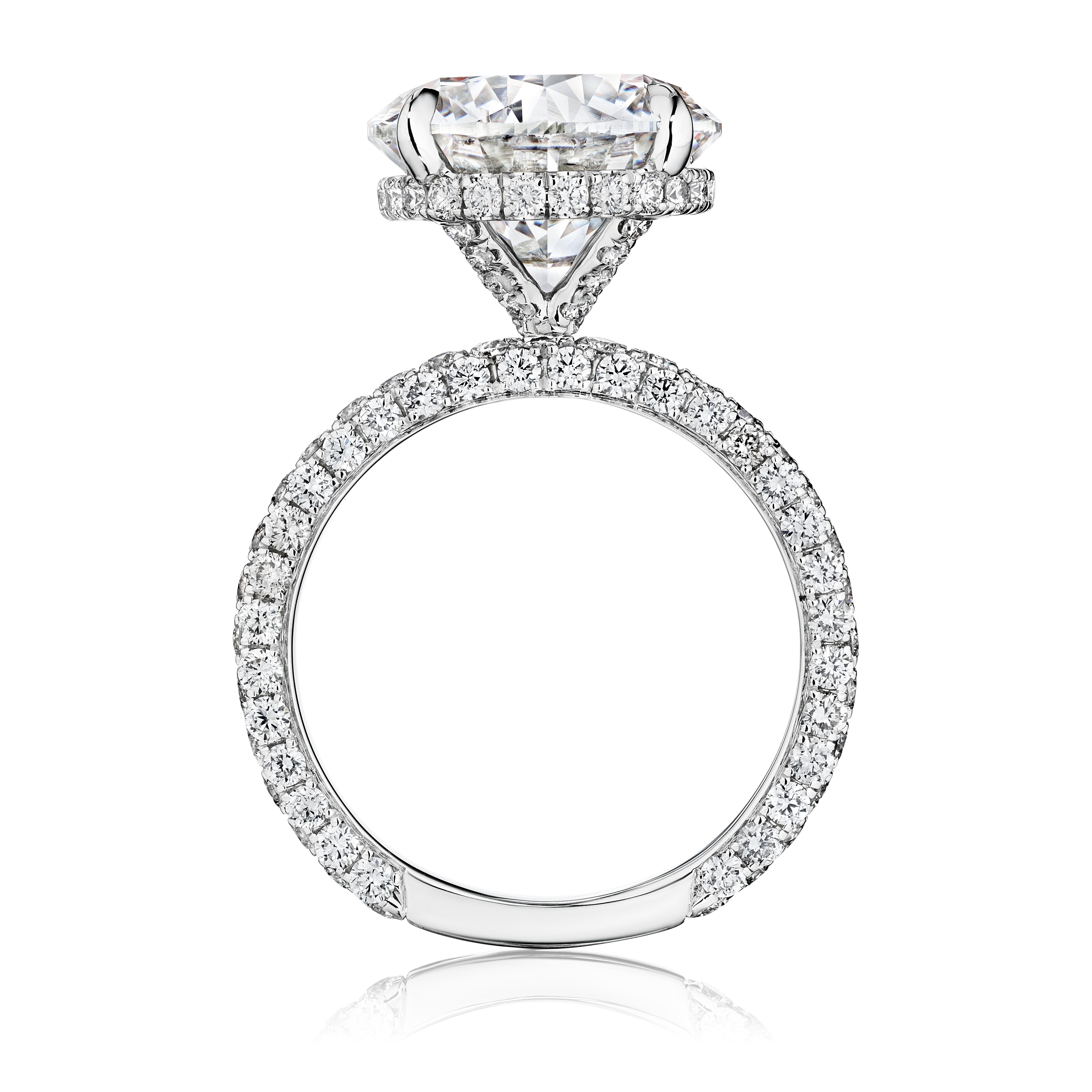 Meet 'Catherine,' a paragon of splendor, this engagement ring is graced with a GIA Certified 5.00 Carat Round Diamond, epitomizing timeless elegance. The round brilliant diamond, renowned for its classic appeal and unparalleled brilliance, is