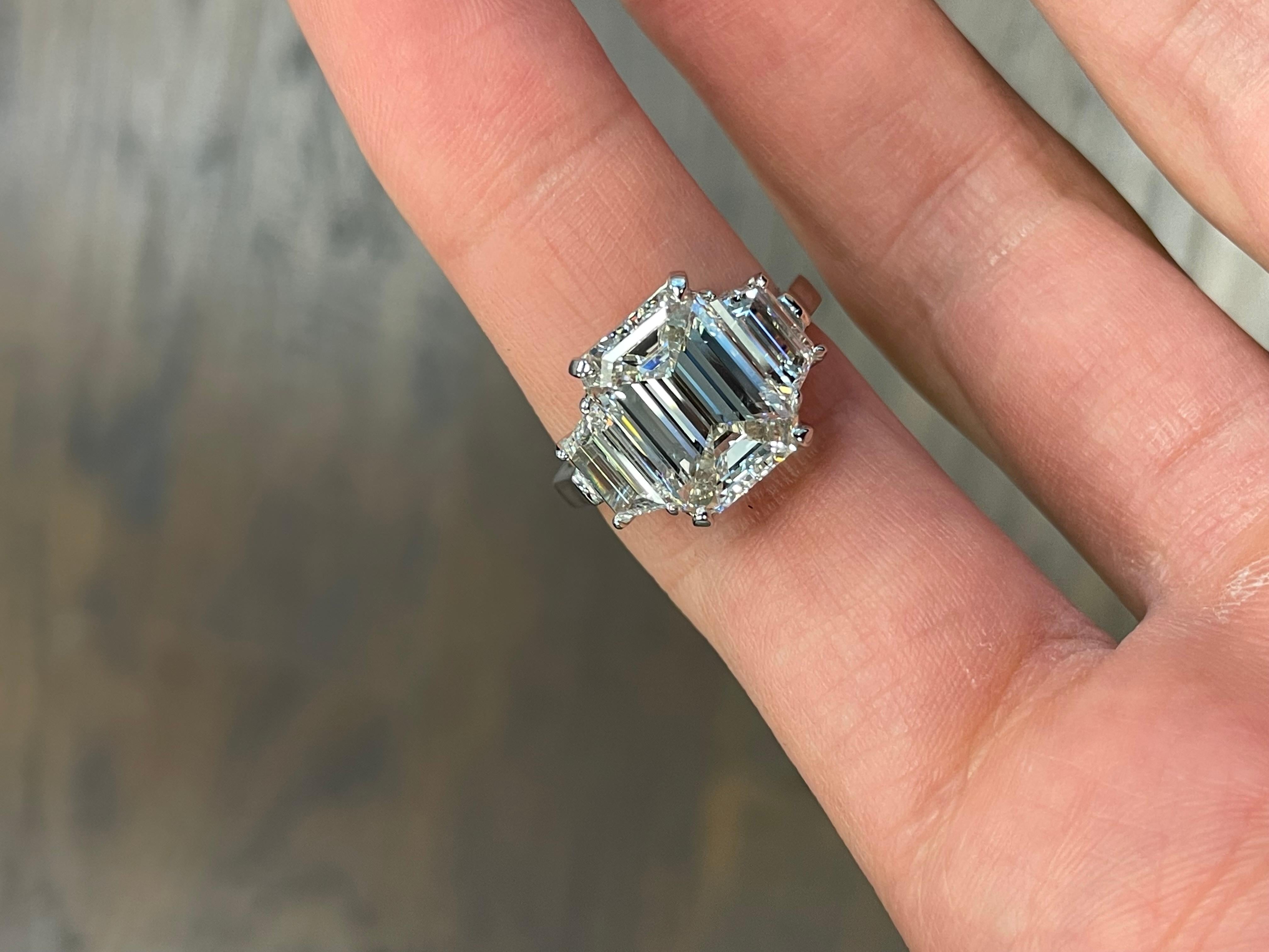 Extraordinary 5.01 Carat Emerald Cut Engagement Ring 

Setting:
Platinum

Center Stone: GIA Certified 5.01 Carat Emerald Cut
Carat Weight: 5.01
Clarity: VS2
Color: H
Measurements: 11.89 x 8.43 x 5.51 mm
GIA # 2225080882

Side Stones: Trapezoid Cut