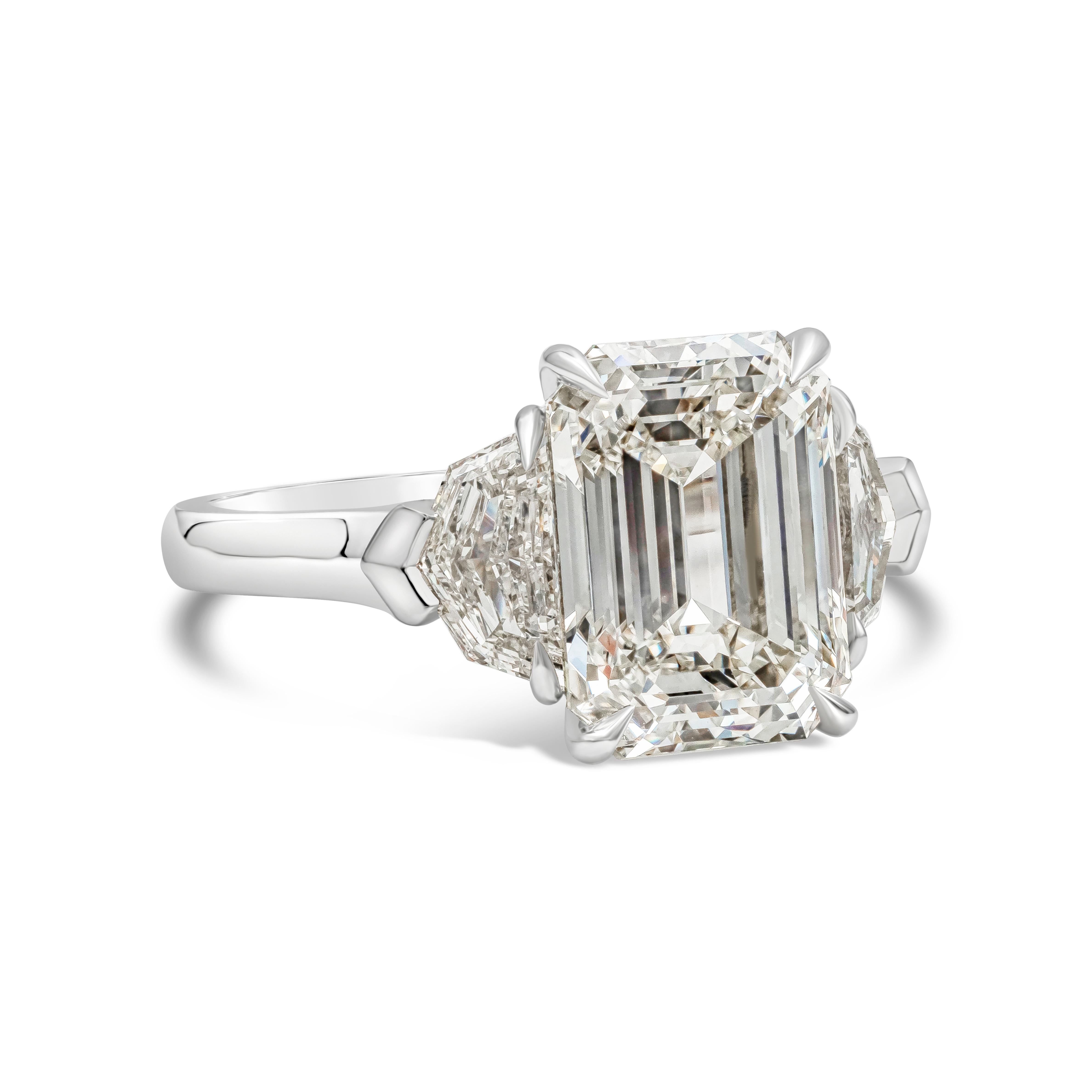 A beautiful and chic engagement ring style showcasing A 5.01 carat emerald cut diamond, certified by GIA as J color, VS1 clarity, excellent polish & symmetry. Accenting the center diamond are two epaulette diamonds weighing 1.10 carats total. Made