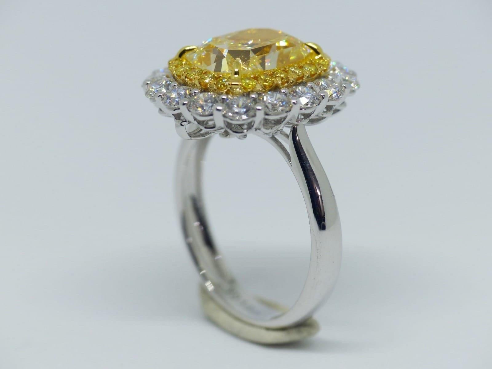 Modern GIA Certified 5.01 Carat Fancy Yellow Diamond Engagement Ring