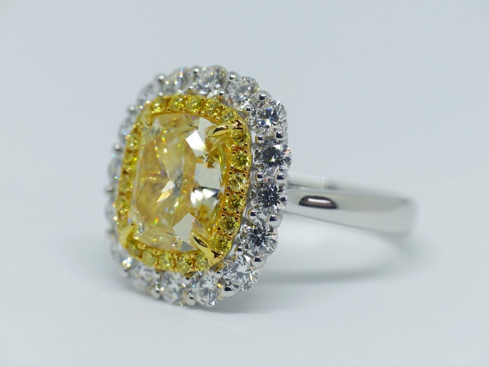 GIA Certified 5.01 Carat Fancy Yellow Diamond Engagement Ring In New Condition In Bangkok, Thailand