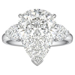 GIA Certified 5.01 Carat Pear Shape Diamond Three-Stone Ring