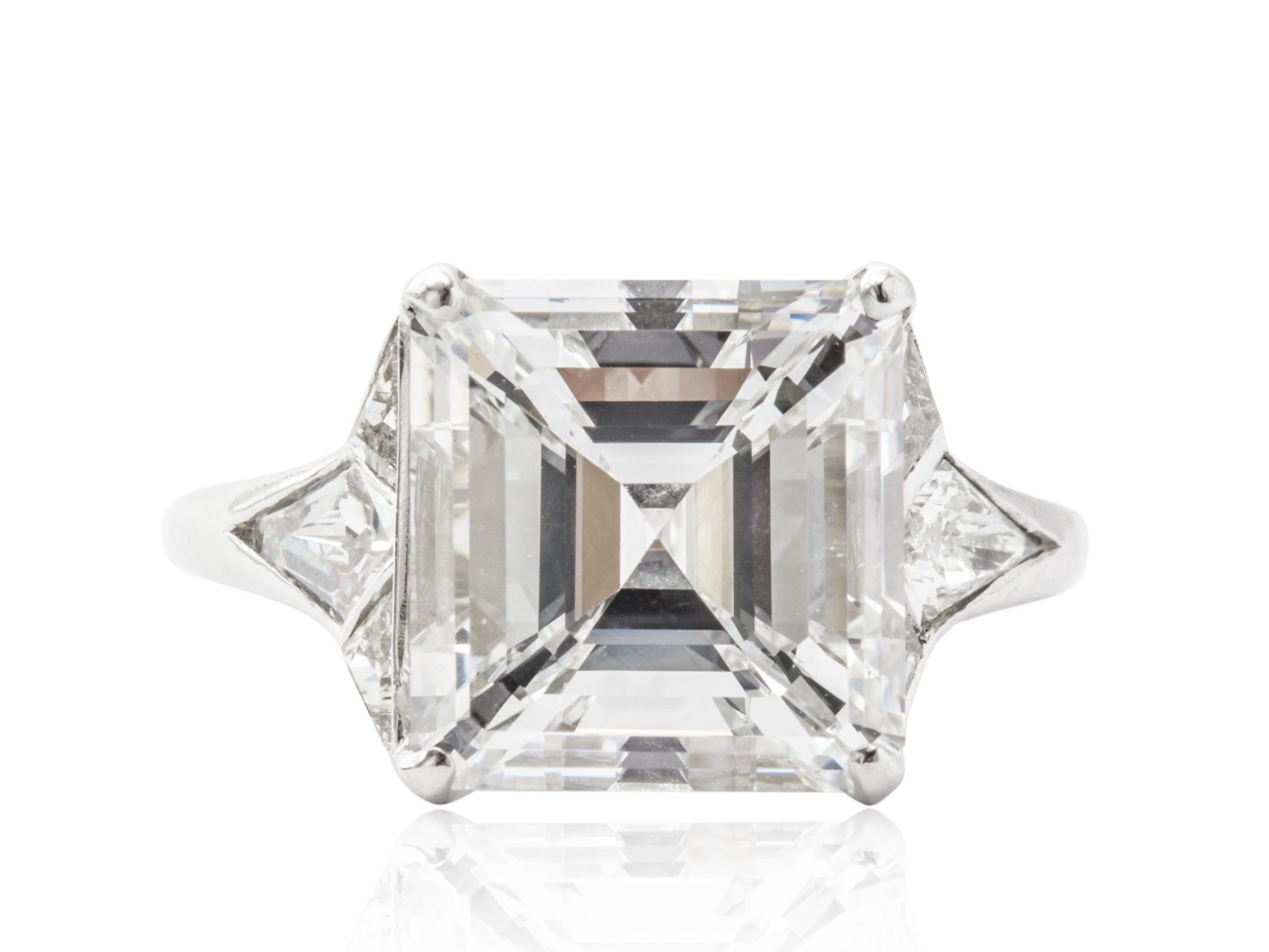 Platinum custom antique Asscher cut Diamond solitaire engagement. Consisting of one fine Asscher Diamond weighing 5.01 E VS2 accompanied by a GIA #12986323 flanked by antique cut kite shape diamonds.