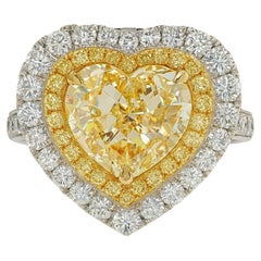 GIA zertifiziert 5,02 Karat Fancy Yellow Heart Diamant Double Halo Ring