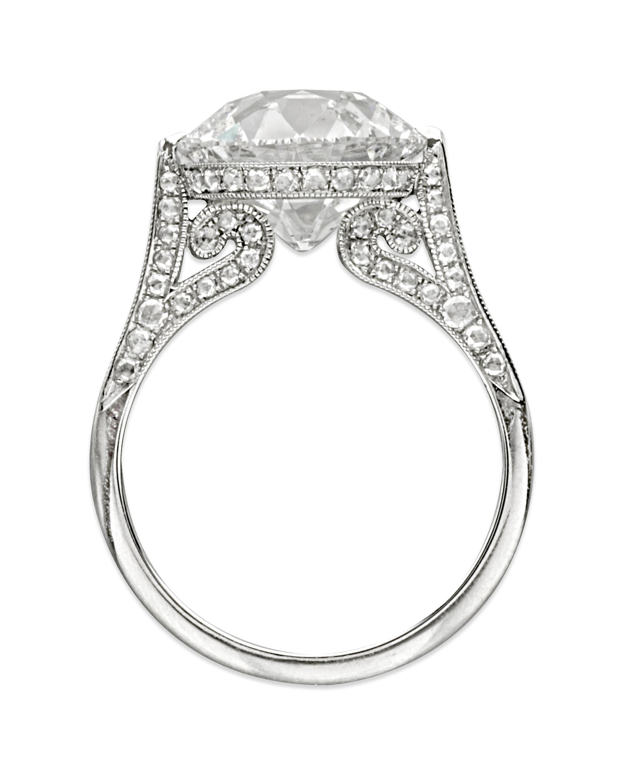 Diamond Ring by Siegelson, New York
Ring inspired by the Belle Epoque; gently sloping shoulders and scroll-shaped supports embellished with round and millegrain borders centering an old European-cut diamond; mounted in platinum
• 1 old European-cut