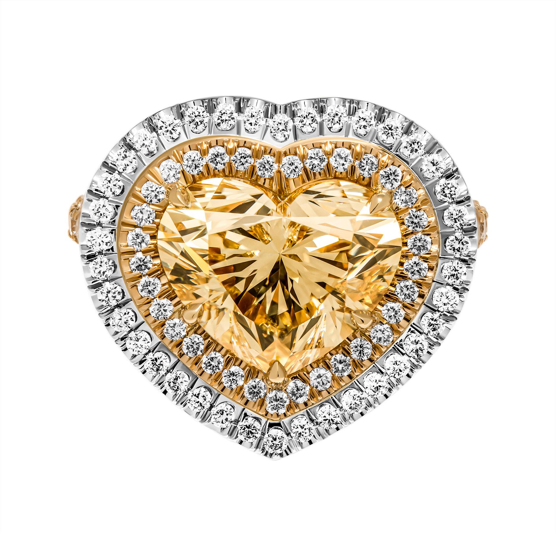 Engagement ring in 18K Yellow Gold & Platinum 
With white diamonds pave, double halo & split shank
Center stone: 5.02ct Natural Fancy Light Brownish Yellow VS1 Heart Shape Diamond GIA#6223048100 
Total Carat Weight of melee: 2.03ct 
Size: 6.25
