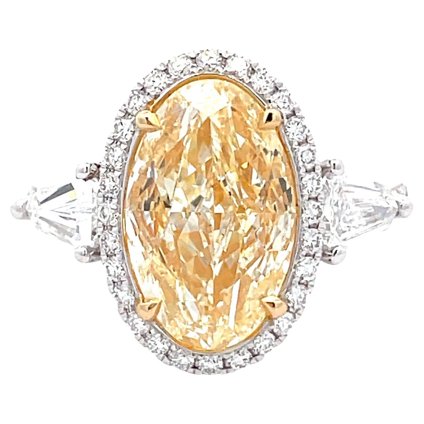 GIA Certified 5.02ct Yellow DIA OVAL with 1.13ct White Dia 18KW RING For Sale