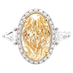 Bague 18 carats avec diamant jaune de 5,02 carats certifié GIA et diamant blanc de 1,13 carat