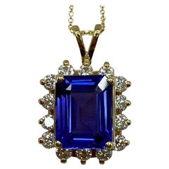 GIA Certified 6ct Emerald Cut Tanzanite & Diamond Yellow Gold Cluster Pendant