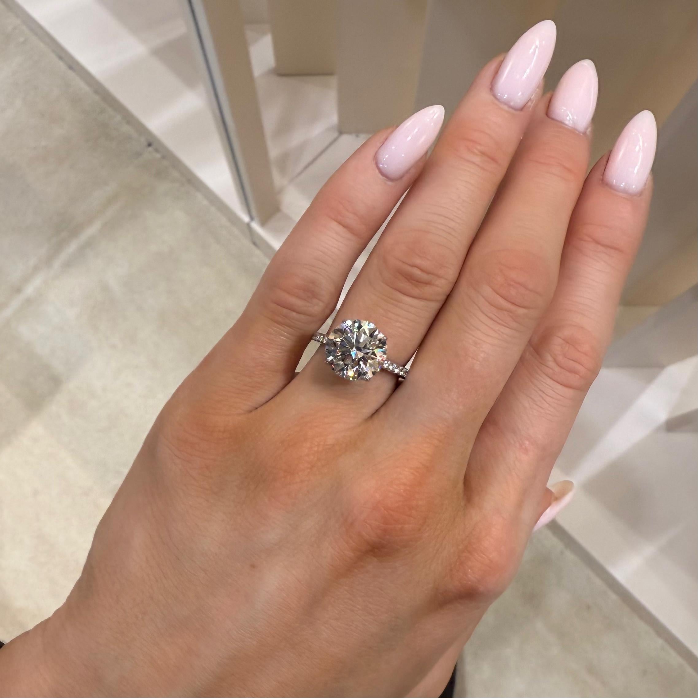 Modern GIA Certified 5.05ct Round Brilliant Cut Engagement Ring For Sale