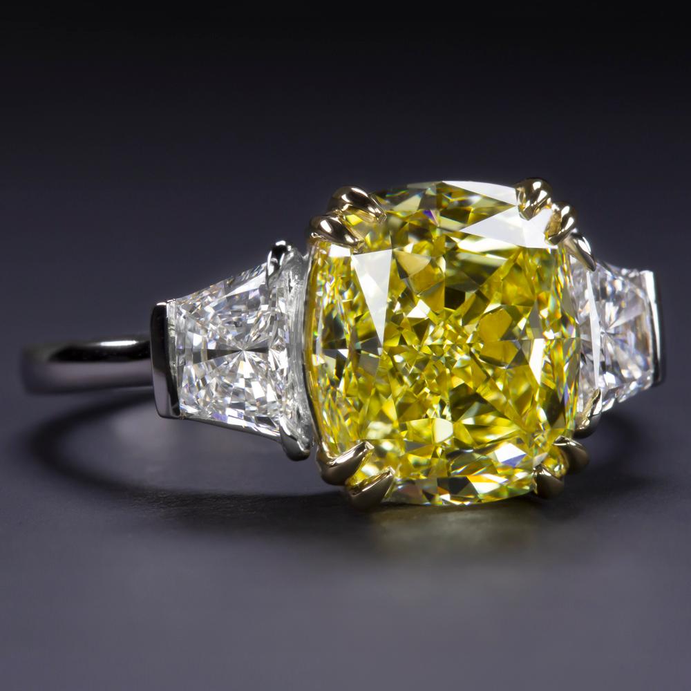 Contemporary GIA Certified 5.02 Carat Cushion Fancy Yellow Diamond Ring VS1 Clarity For Sale
