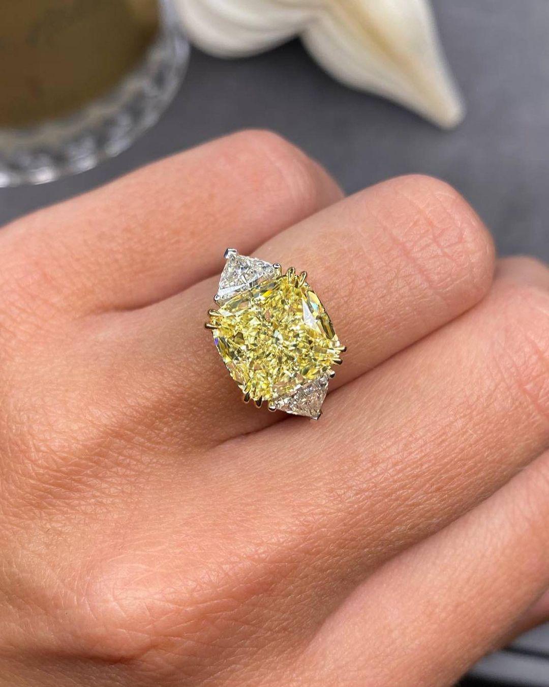 Cushion Cut GIA Certified 5.06 Carat Fancy Yellow Diamond Ring with Trillion Diamond For Sale