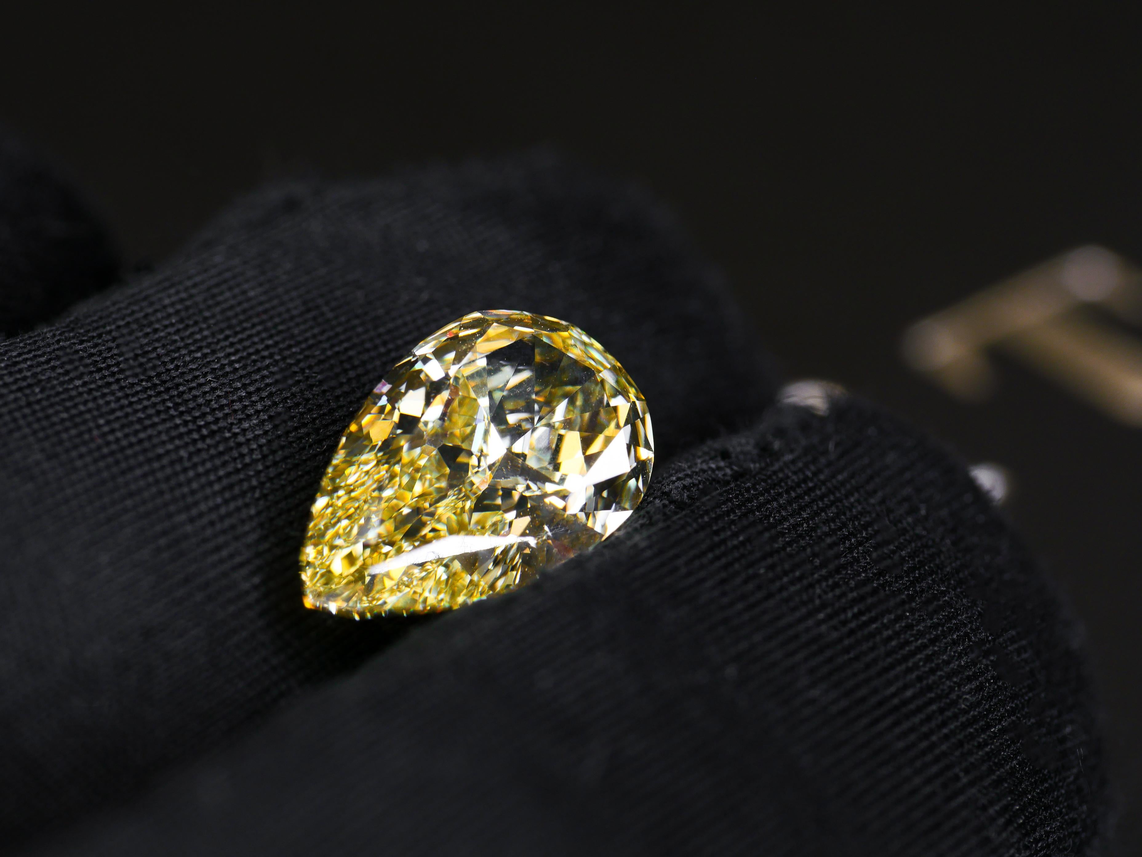 GIA Certified 5.06 Carat Fancy Yellow Pear Cut Diamond In New Condition For Sale In MELBOURNE, AU