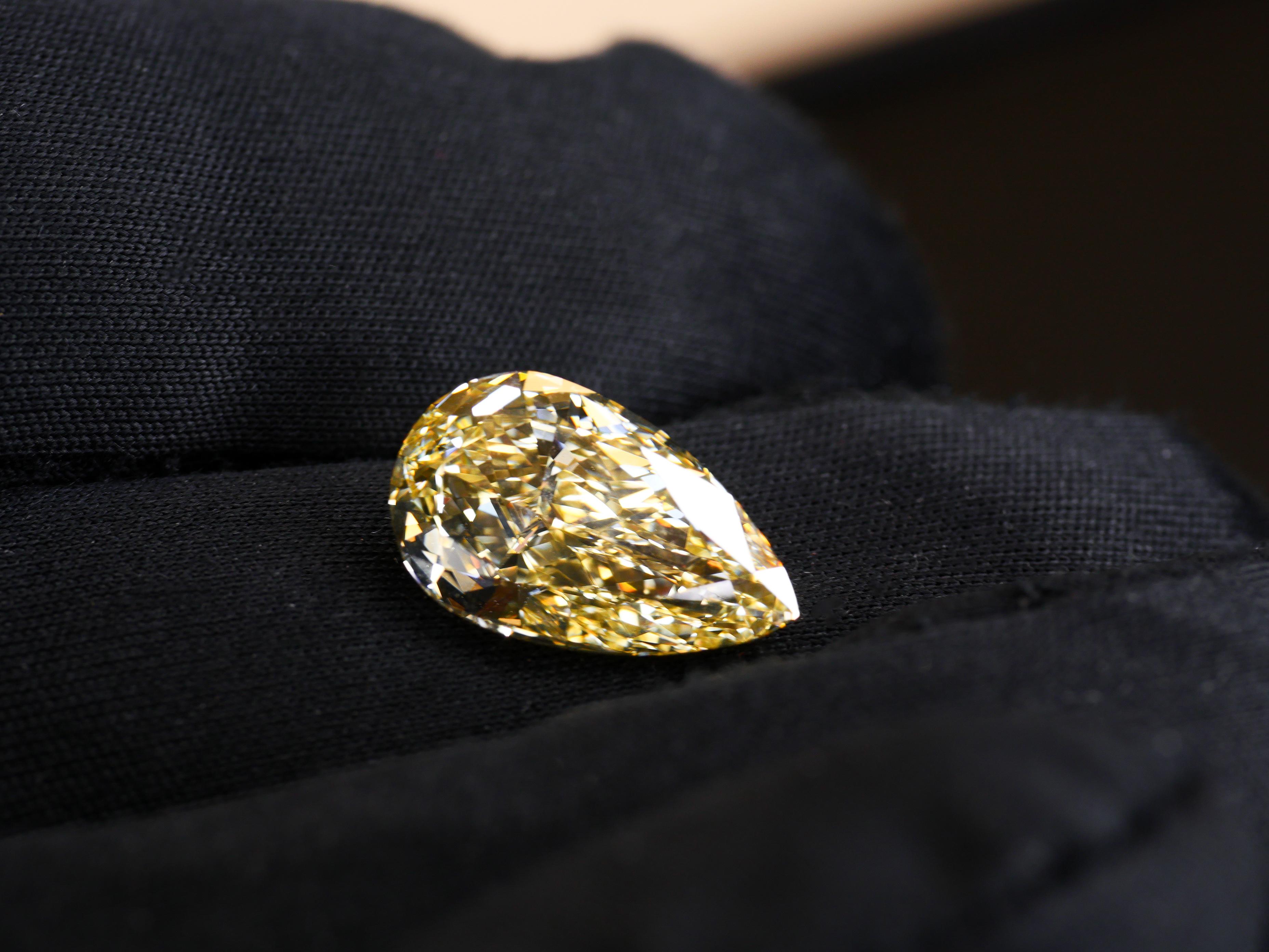 Women's or Men's GIA Certified 5.06 Carat Fancy Yellow Pear Cut Diamond For Sale
