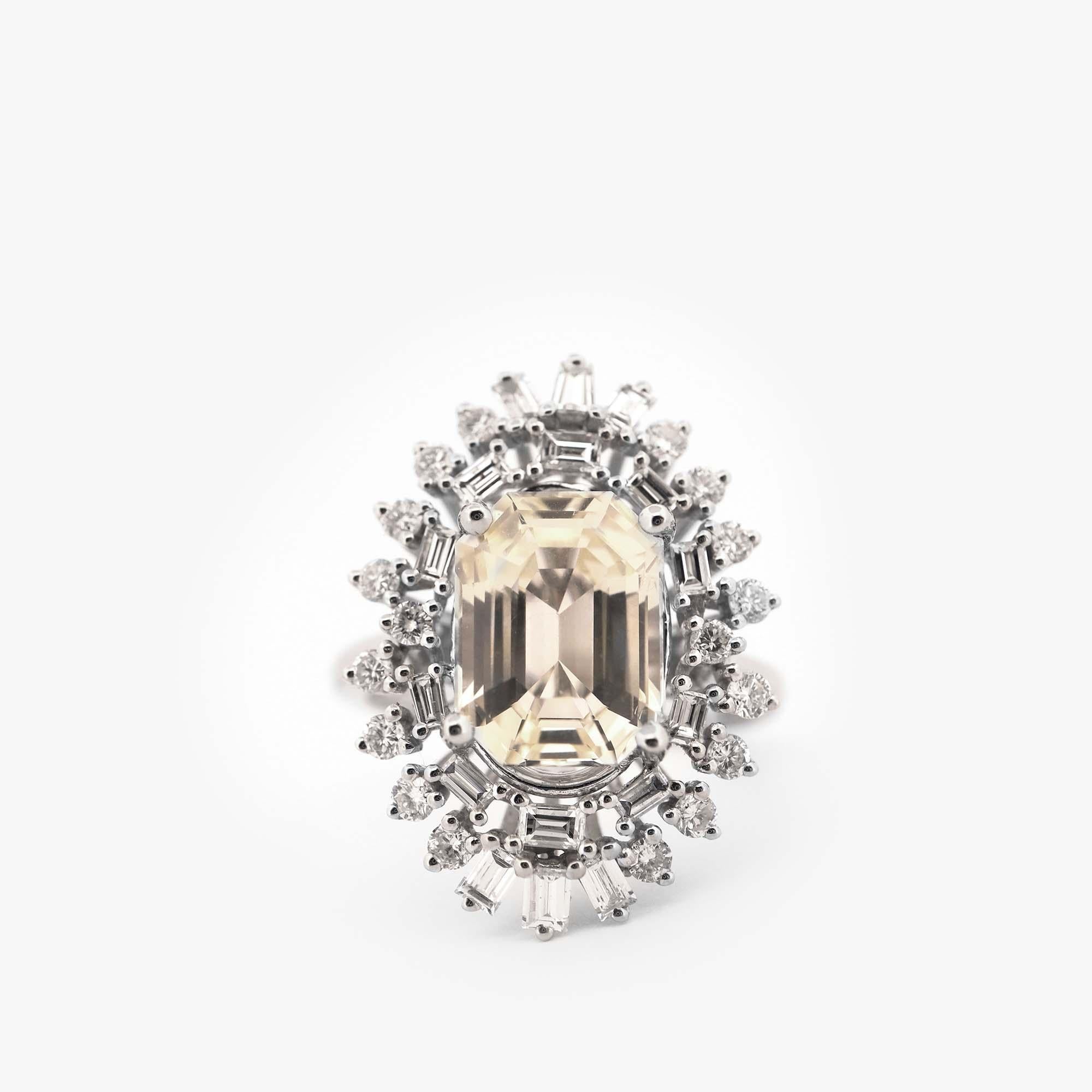 This GIA certified 5.06 CT Pale Yellow Sapphire and 1.08 Diamond Ring is a stunning piece of jewelry that is sure to capture the imagination of anyone who sets their eyes upon it. The ring features a beautiful, pale yellow sapphire at the center,