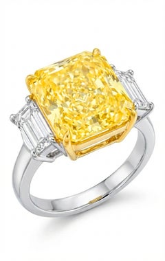GIA Certified 5.07 Carat Fancy Intense Yellow Diamond Three-Stone Ring
