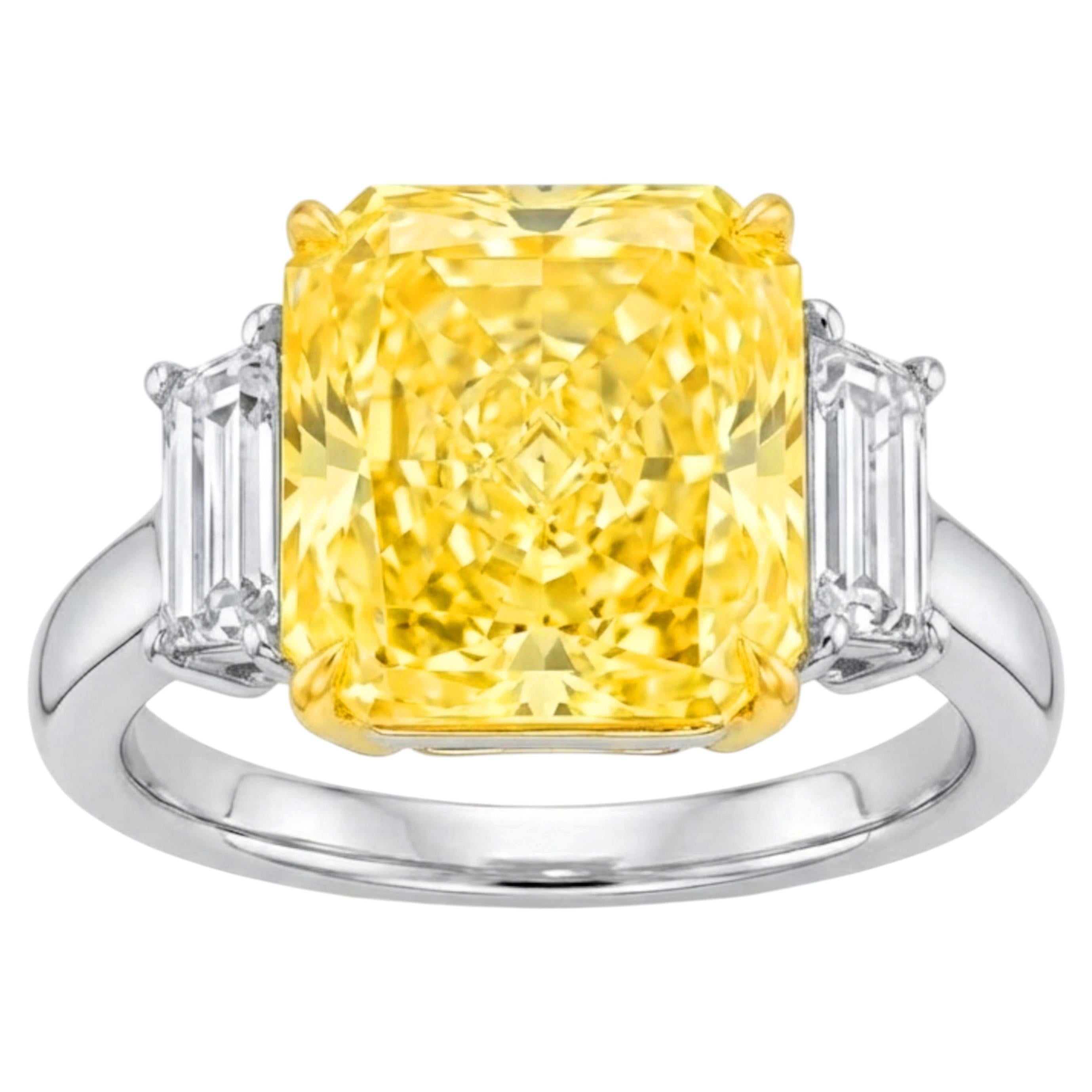 GIA Certified 5.07 Carat Fancy Intense Yellow Diamond Three-Stone Ring For Sale