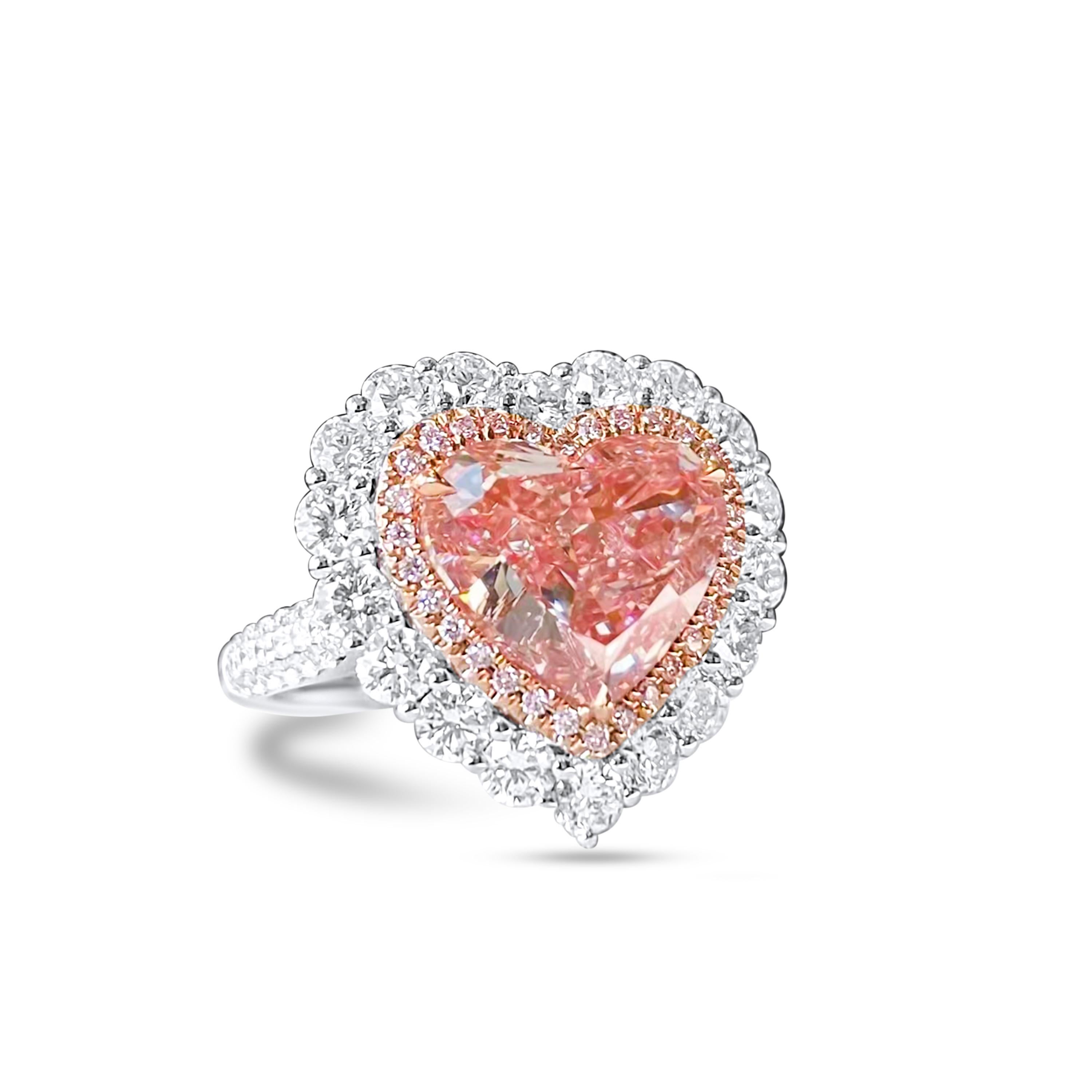 We invite you to discover this rare and modern cocktail ring set with a 5,07ct carat GIA certified Light Pinkish Brown heart  diamond accented with two round diamond halos colorless. The surprise of this magnificent jewel is that it can also be worn