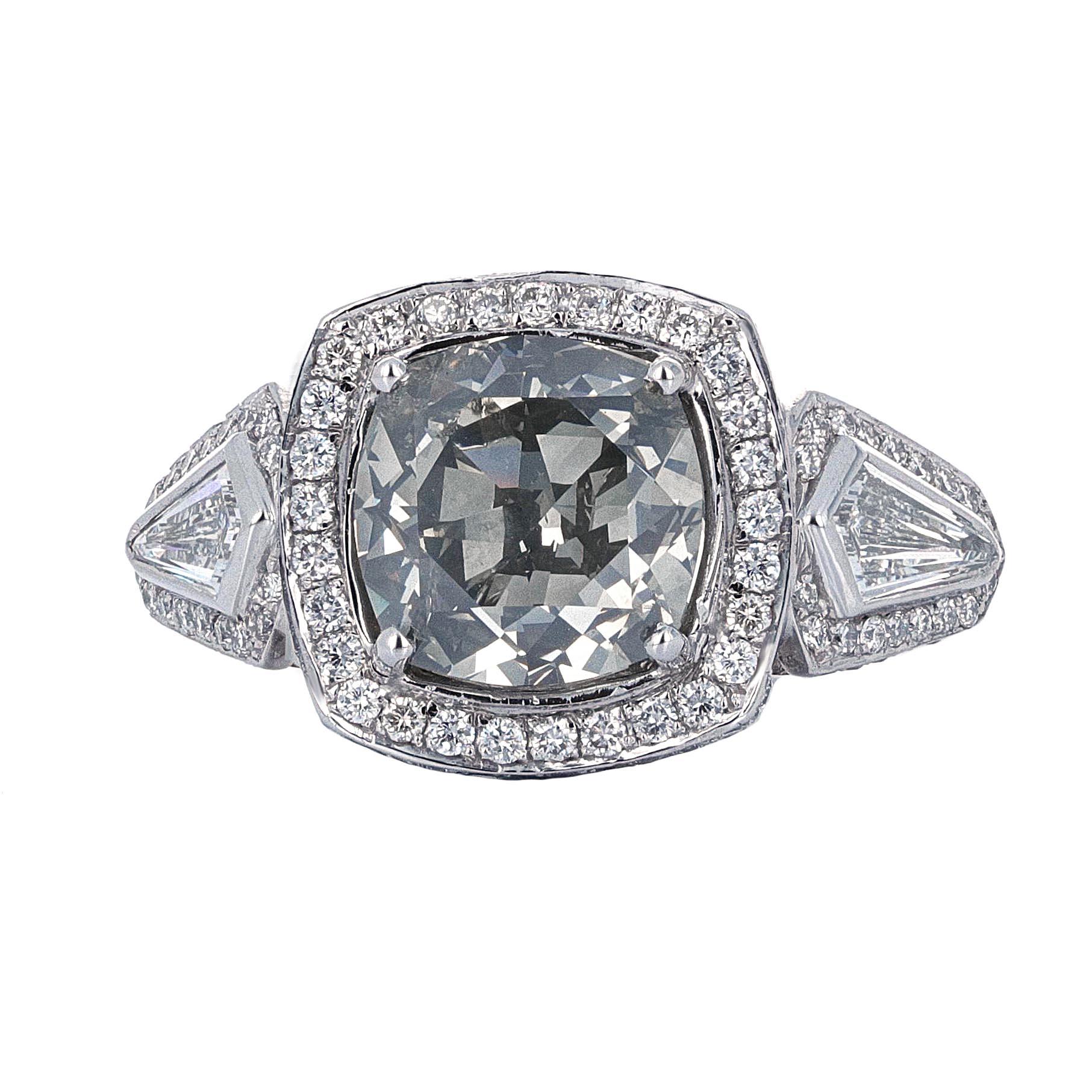 GIA certified, 5.08 carat Fancy Gray diamond engagement ring. The GIA describes the center stone as a cushion modified brilliant weighing 5.08 carats. The color is Fancy Gray and has even color distribution. The stone measures 9.33 x 9.28 x 7.17 mm