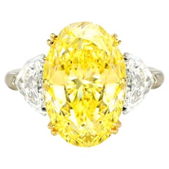 GIA Certified 5.08 Carat Fancy Yellow Oval Cut Diamond Platinum Ring