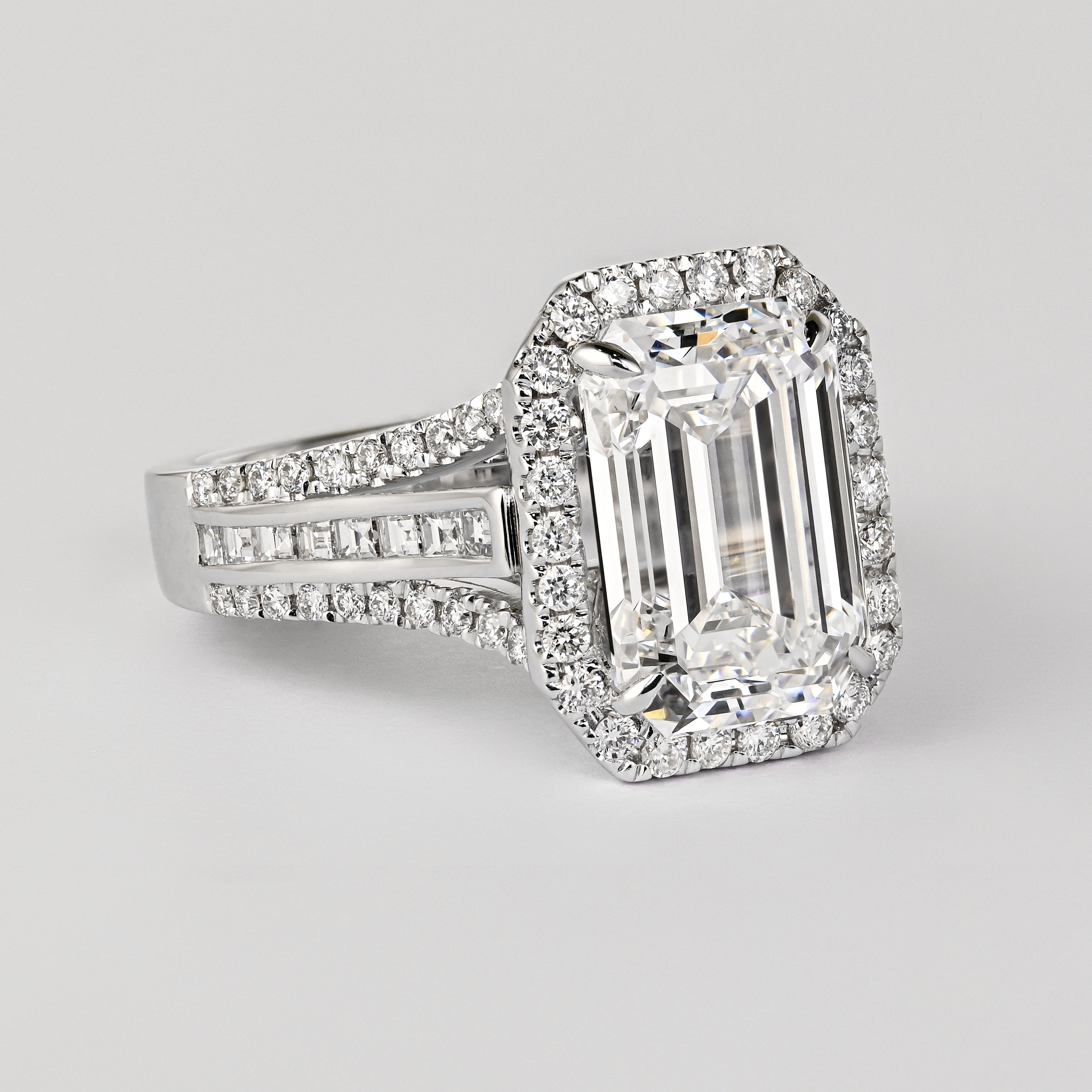 Modern GIA Certified 5.09 Carat D Color VVS2 Clarity Emerald Cut Diamond 18K Ring For Sale