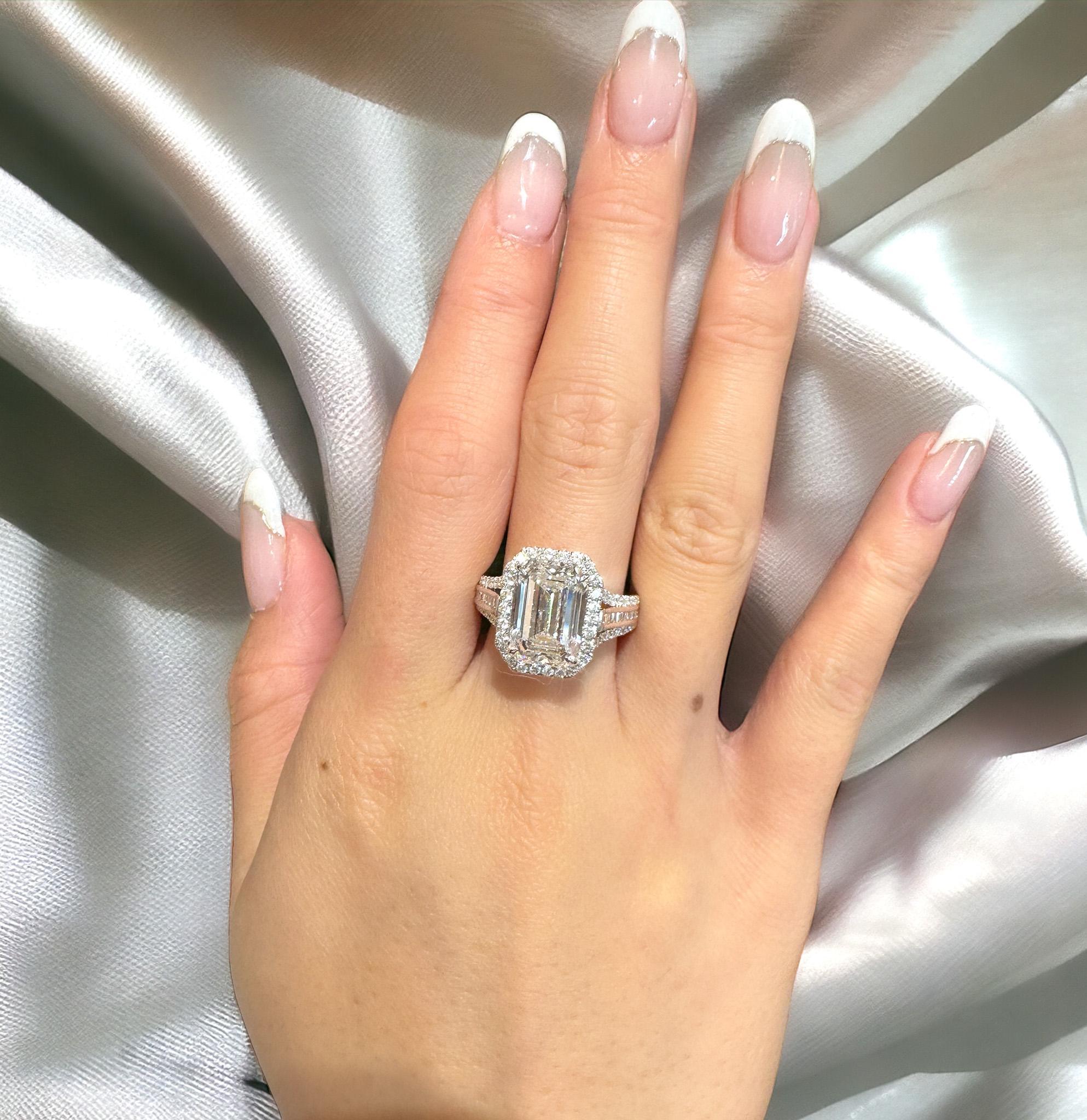 GIA Certified Natural 5.09 Carat Emerald Cut D/VVS2 Diamond and Round 0.90 CTTW Diamond Engagement Ring. The best color grade mother nature has to offer. A serious investment piece that transends most of the diamonds available today. 

Surrounded by