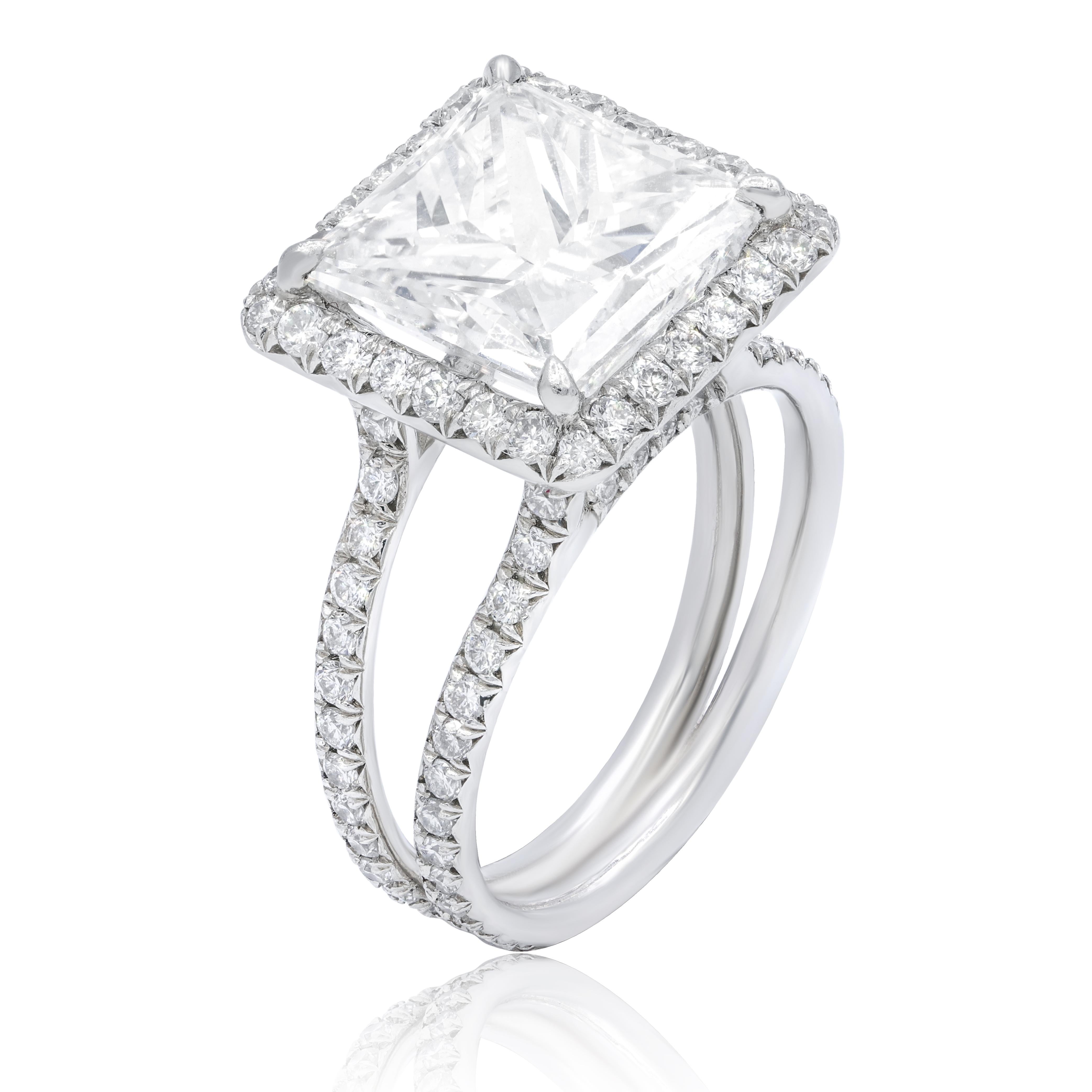GIA Certified 5.09 Carats E-VS2 Princess cut Engagement Ring, Certified by GIA, surrounded by 2.00 carats of round cut diamonds. 
Custom made ring. 