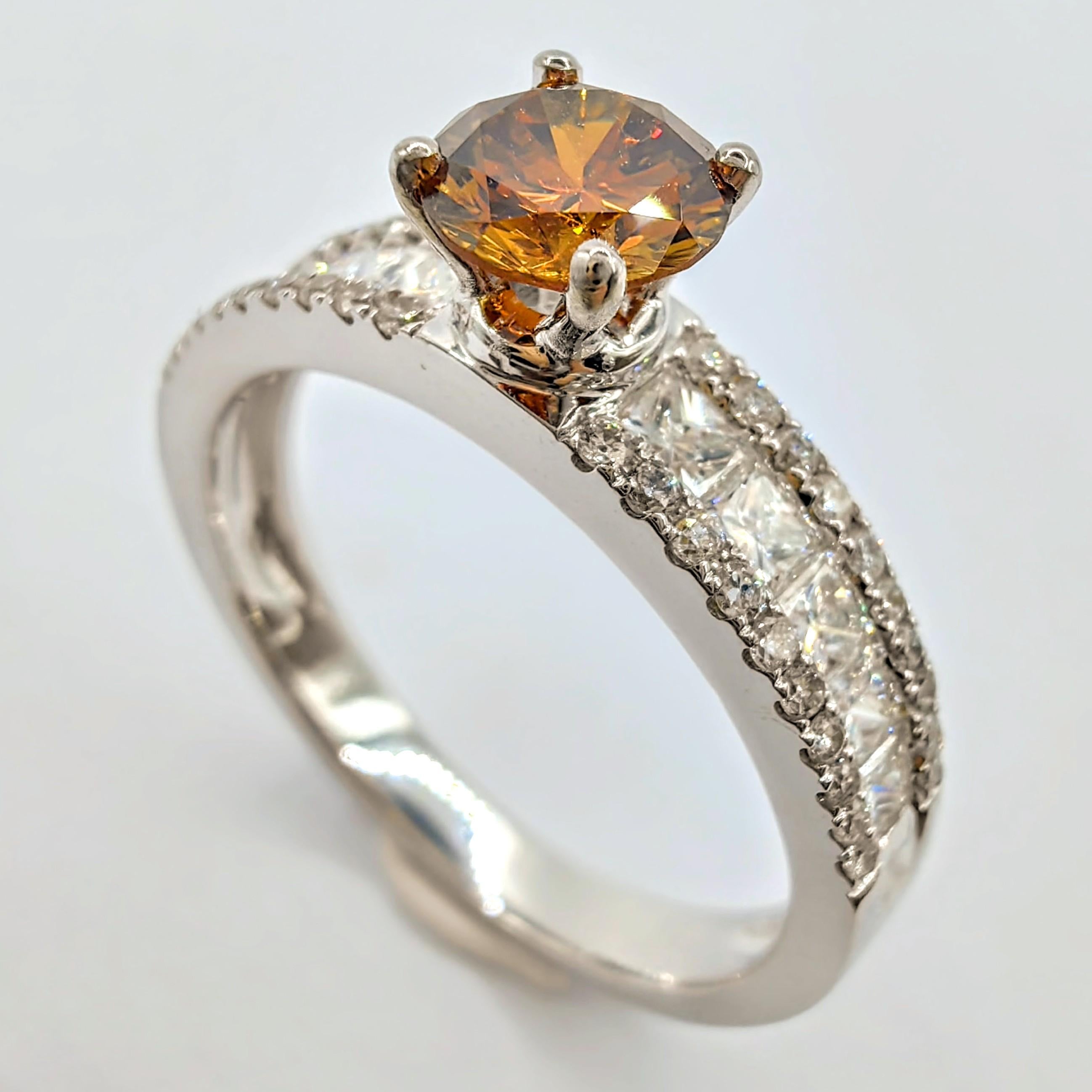 Introducing our exquisite GIA Certified .51 Carat Fancy Deep Orange-Brown Diamond Ring in 18K White Gold, a true masterpiece that exudes elegance and sophistication.

At the center of this ring is a stunning round brilliant cut fancy deep