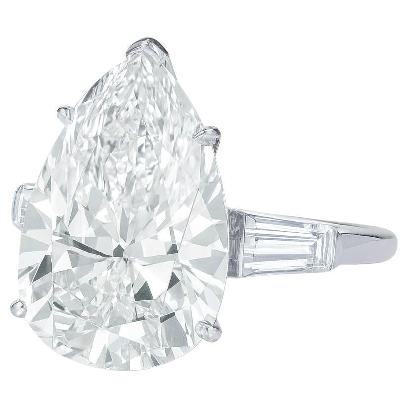 GIA Certified 5.10 Carat Pear Cut Diamond Ring with Tapered Baguettes in 18K White Gold

An extraordinary diamond ring featuring a magnificent GIA-certified 5.10 carat pear brilliant cut diamond, perfectly complemented by tapered baguette side