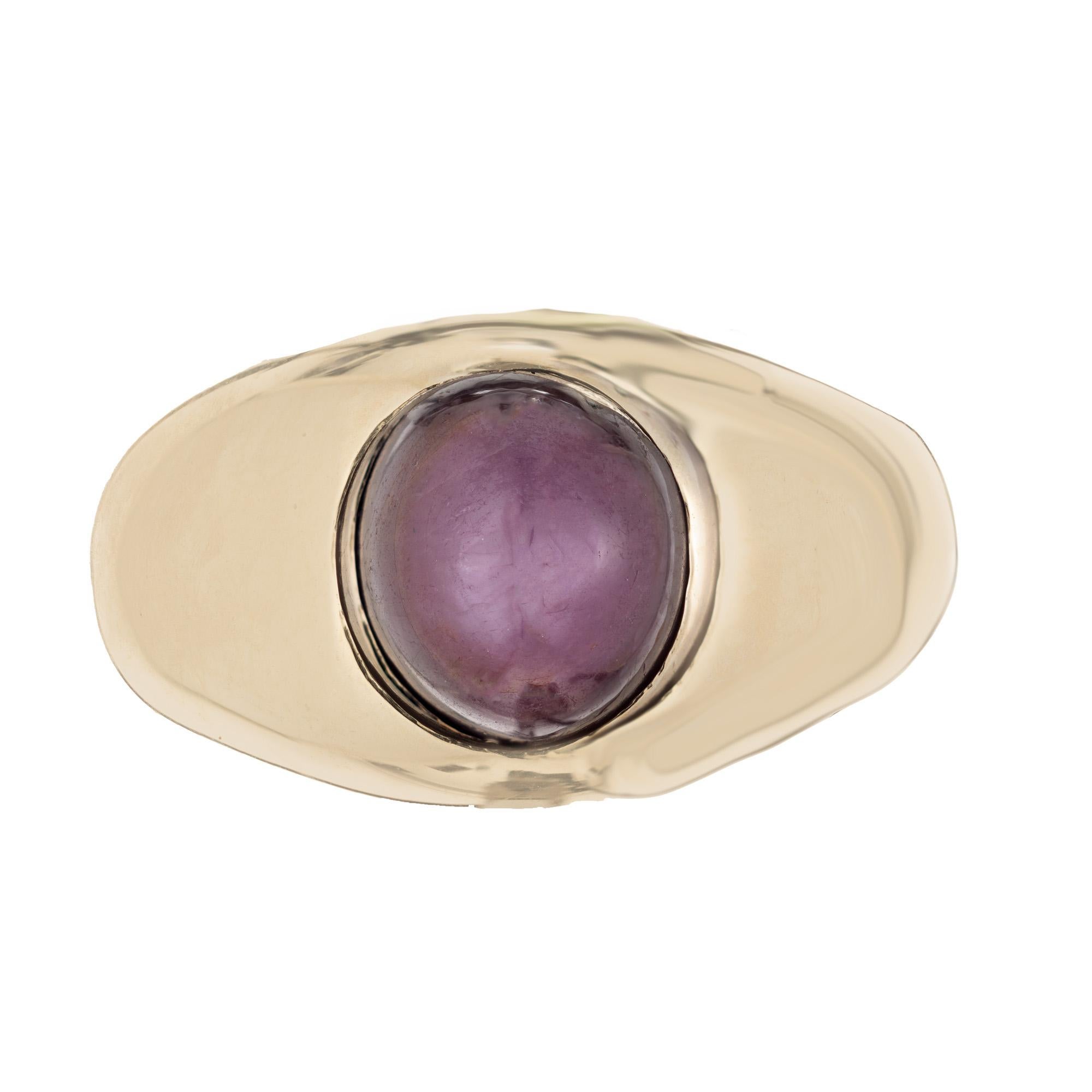 1960's Star Cabochon Ruby yellow gold men's Ring. The center piece of the ring is an oval shaped 5.10ct star ruby. The ruby is rich and deep in color and warmth with the star being visible in lighting and movement. The stone is meticulously set in a