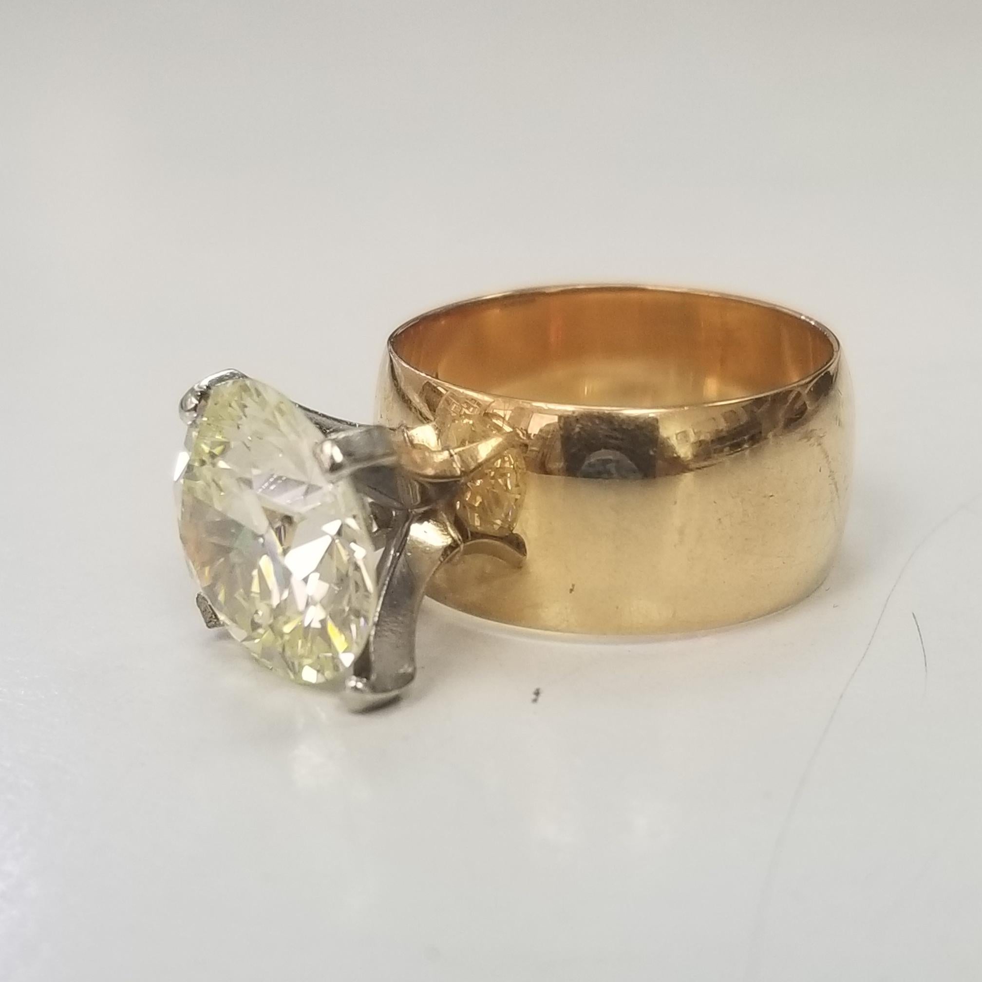 *SALE* PLEASE MAKE A FAIR OFFER
14k yellow gold 8.8mm band size 6.5
GIA Certified 5.11 Carat S-T Color and VVS1 Clarity 
11.30 - 11.38 - 6.38
Table: 57  Girdle: TN - M
Polish: Good  Symmetry: Fair
inscribe; 5221727786