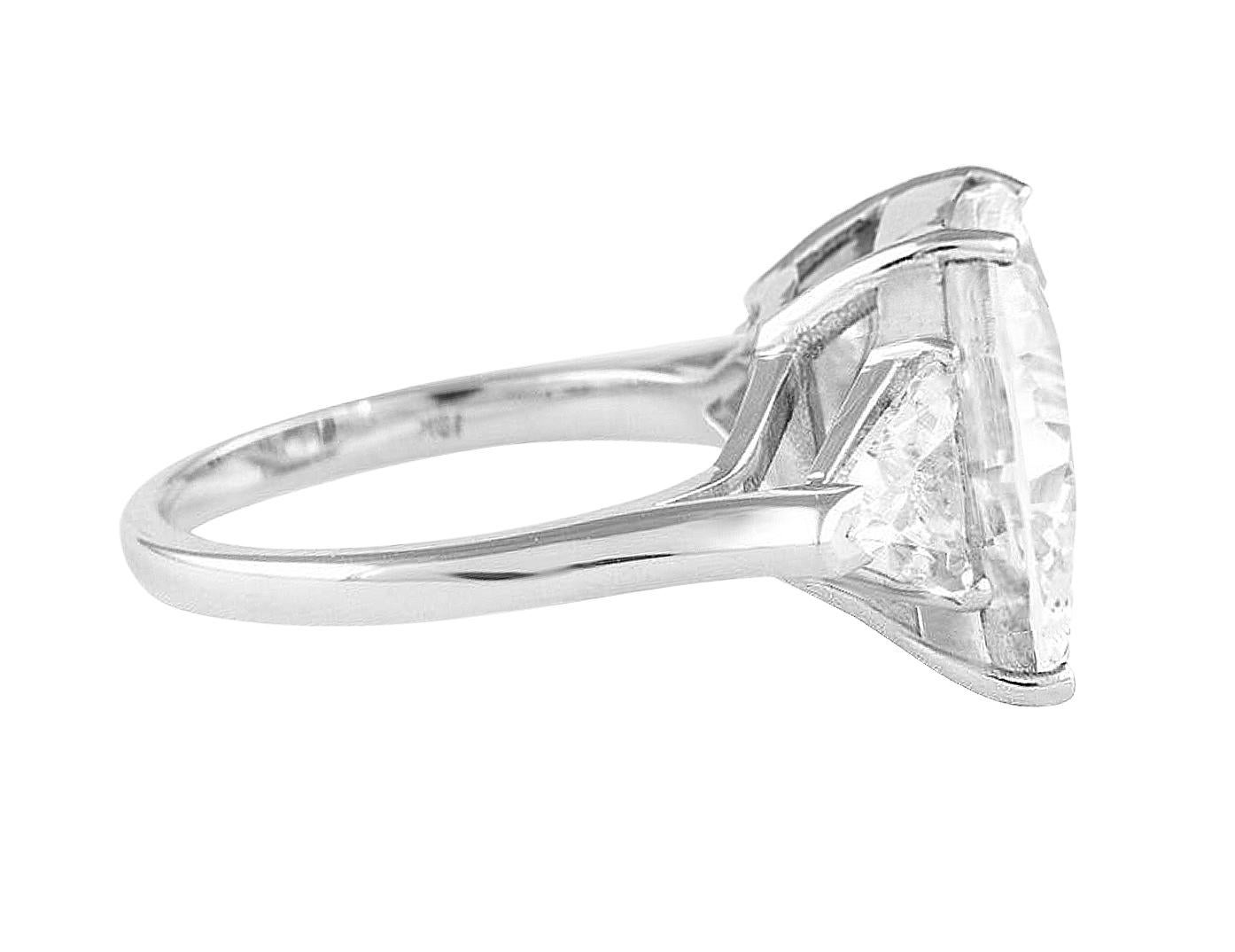 Forged in the refinement of solid platinum, this ring is a marvel of jewelry artistry featuring a resplendent 5 carat cushion cut diamond. 

With the Gemological Institute of America's certification, the diamond is distinguished by a H color rating,