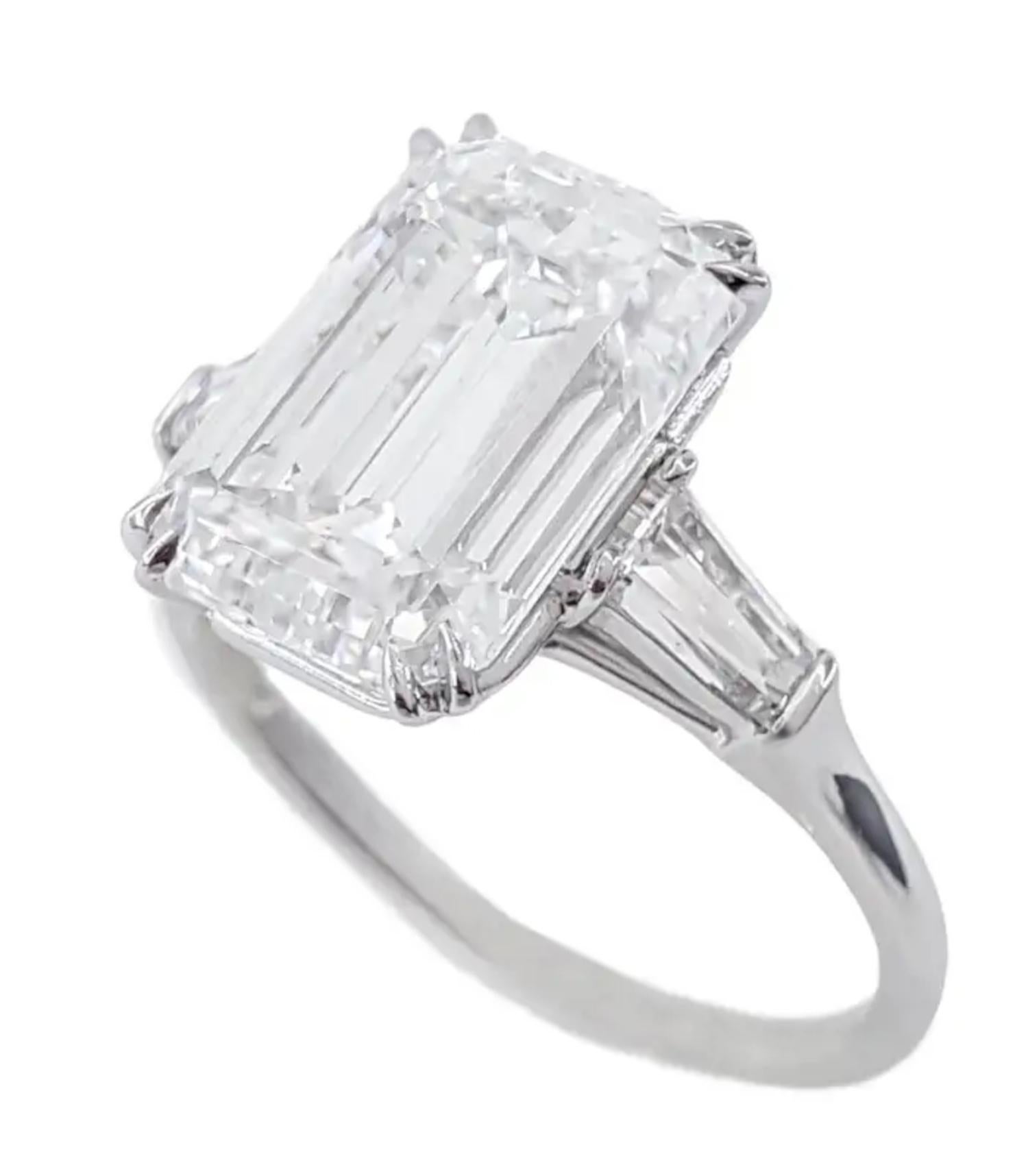 An icon of timeless sophistication, this exceptional Antinori creation features a breathtaking GIA Certified 5.02 carat Emerald Cut Diamond, masterfully set in a sleek platinum mounting with elegant tapered baguette diamonds accenting each