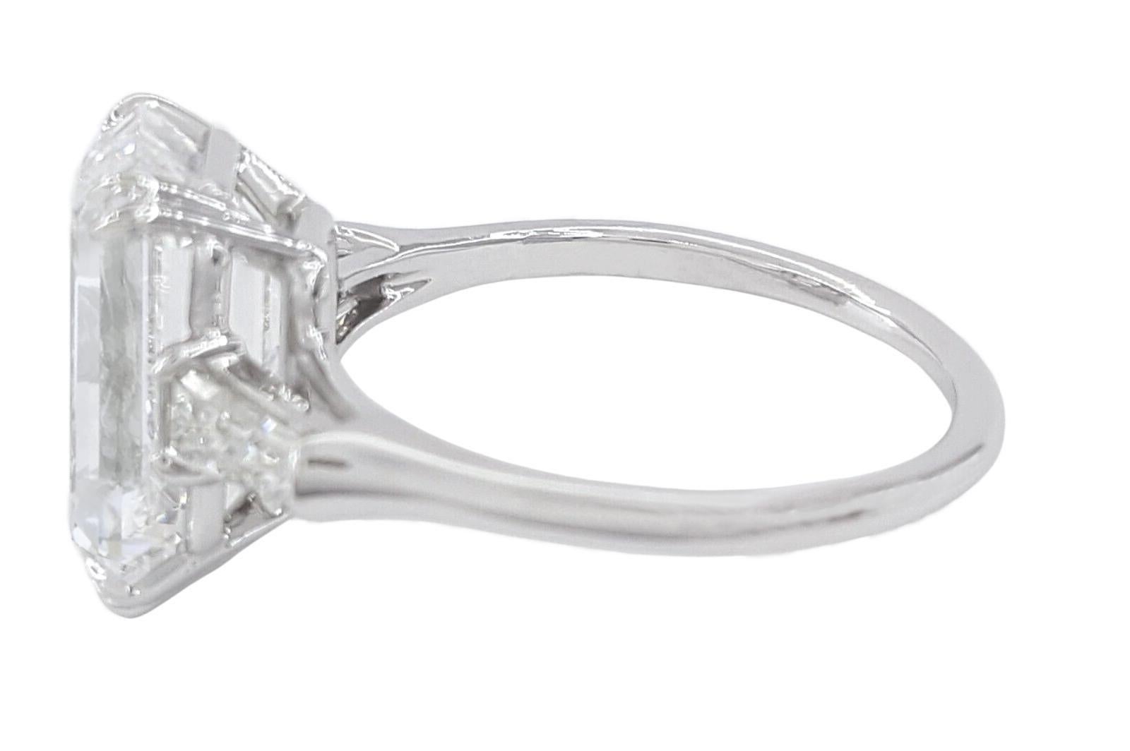 Contemporary GIA Certified 5.02 Carat Emerald Cut Diamond Ring with Tapered Baguette For Sale