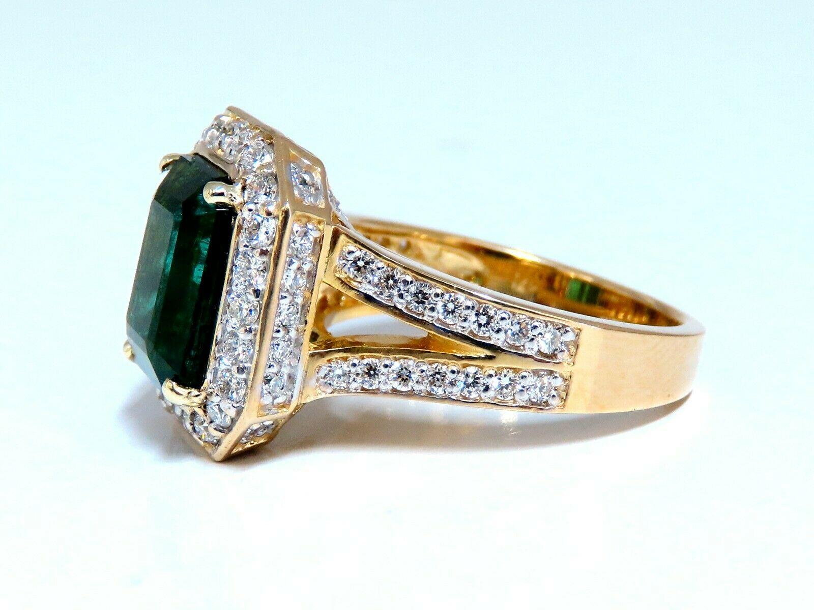 Classic Rectangular Deck Deco Green.

5.12ct. Natural Emerald cut, Emerald Ring

GIA Certified: #2354603111

10.93 x 9.02 x 6.41mm

Transparent, Green (F1)

1.20ct. Diamonds.

Round & full cuts 

G-color Vs-2 clarity.  

14kt. yellow gold

8.9