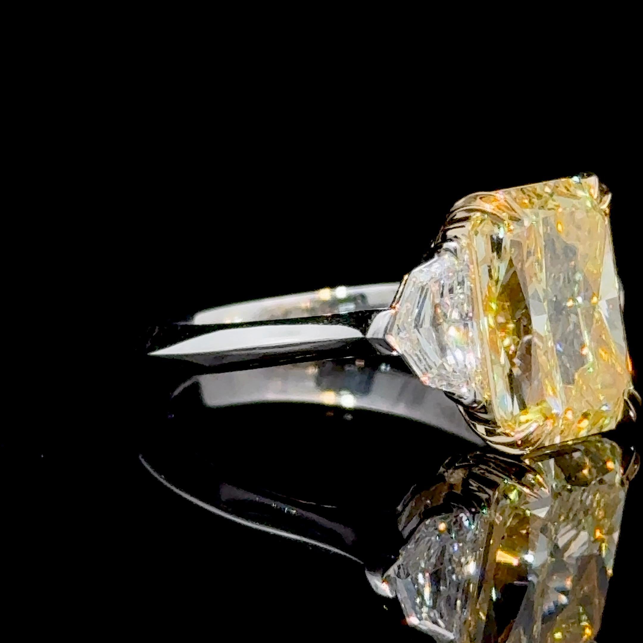 GIA Certified 5.13 Carat Rectangular Radiant Cut Fancy Yellow Three Stone Ring

Our signature Three Stone Ring featuring a top calibre, 5.13 Carat Natural Rectangular Radiant Cut Fancy Yellow Diamond
with GIA specifications to match: VVS2 Clarity,