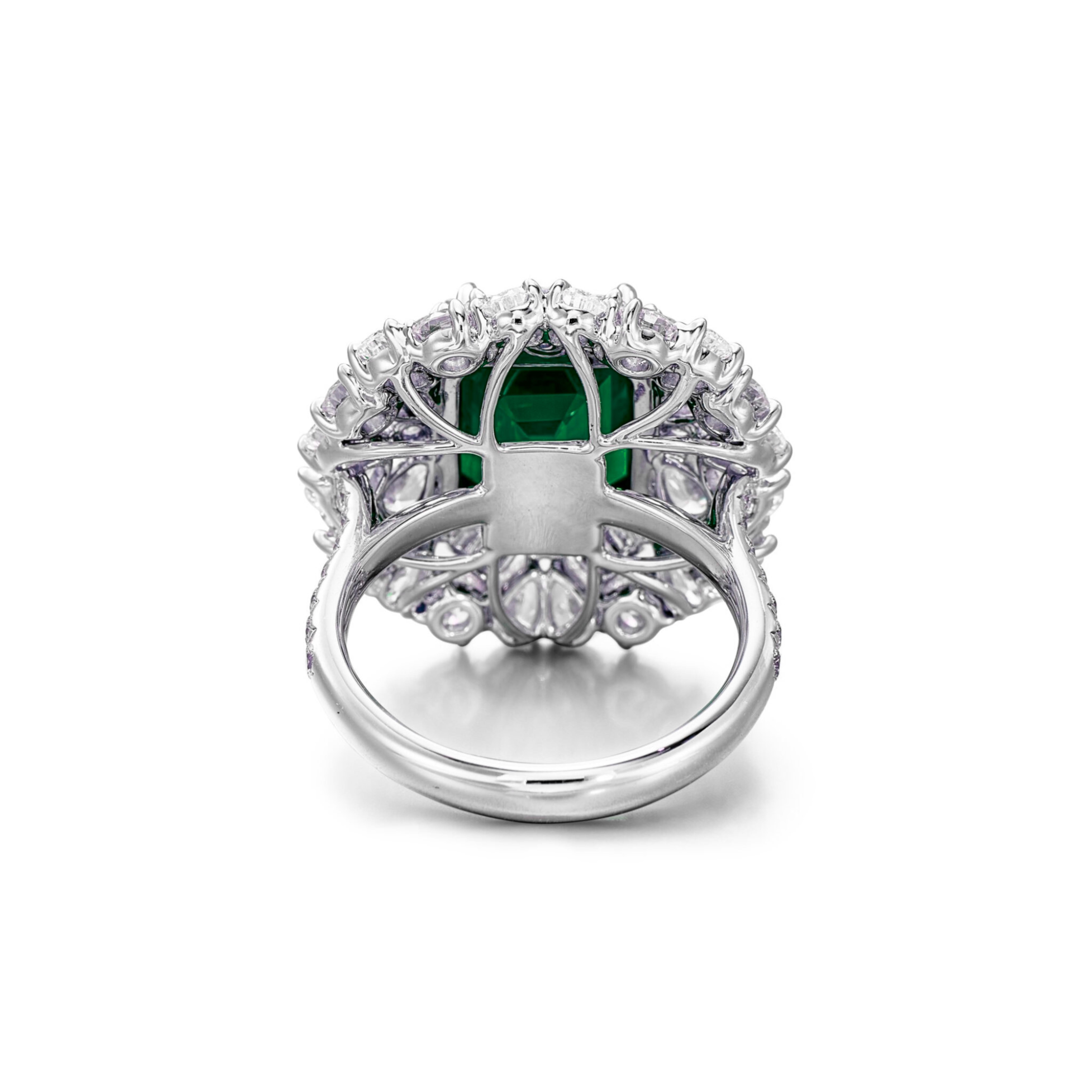 GIA Certified Set with a step-cut minor oil emerald weighing 5.14 carats, within a surround of pear-shaped and brilliant-cut diamonds, mounted in 18 karat white gold



