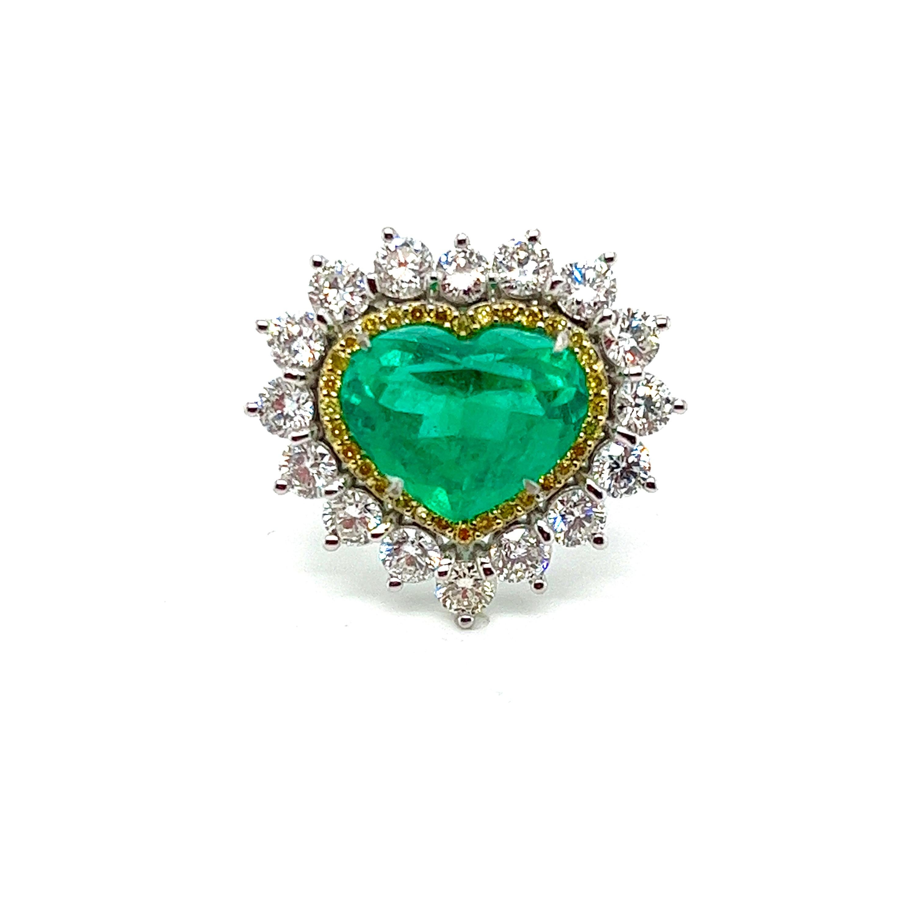 Captivating 5.15-Carat Colombian Emerald Ring with Yellow and White Diamond Halo

Embrace the enchanting allure of nature with our stunning Colombian Emerald Ring, featuring a magnificent 5.15-carat heart-shaped green crystal emerald sourced