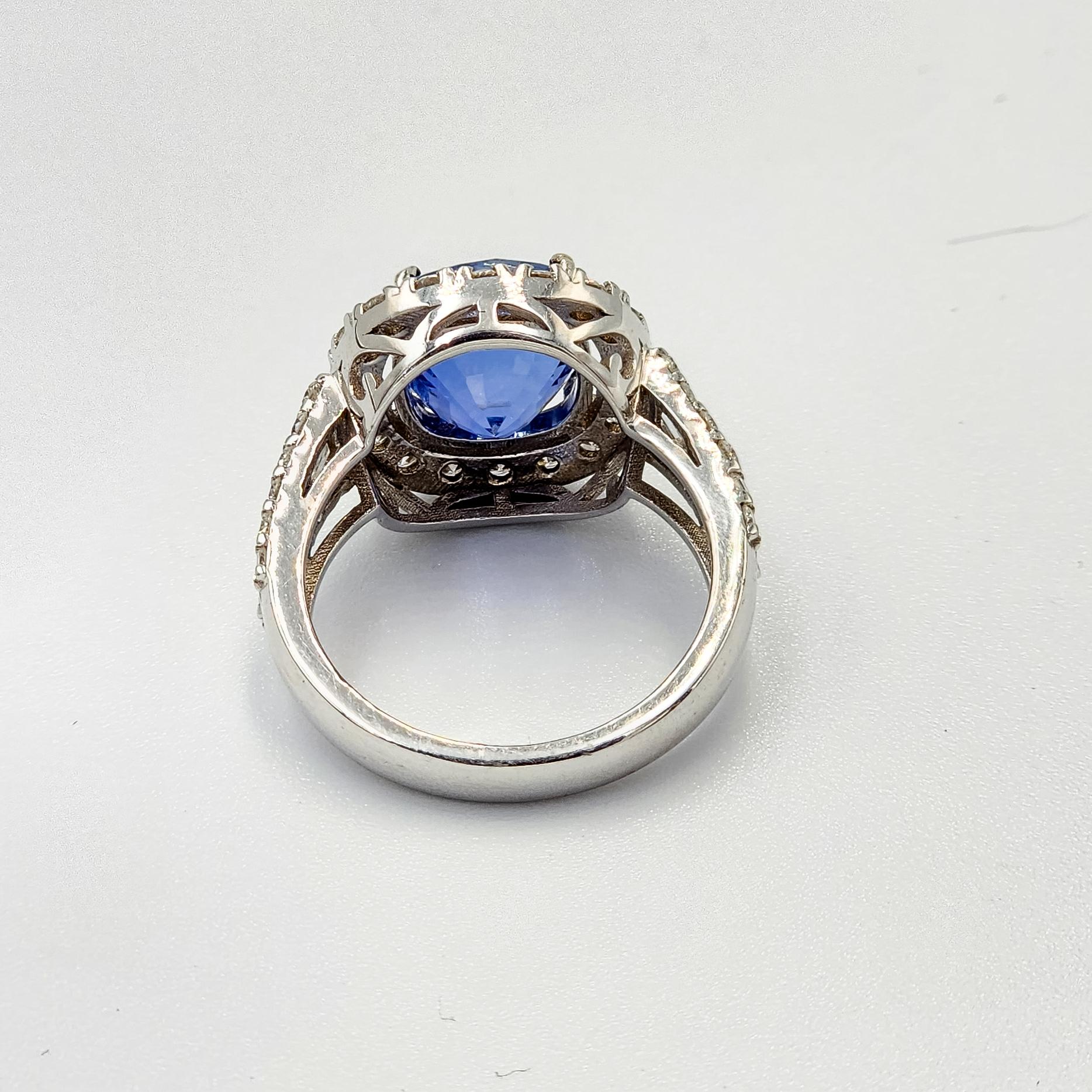This is a beautiful GIA certified Blue Sapphire Ring with diamonds and 18k gold. It is a beautiful and amazing piece with vivid color, set in a custom designed ring to enhance its natural beauty!
Blue Sapphire : 5.16  carats
Certificate:   GIA