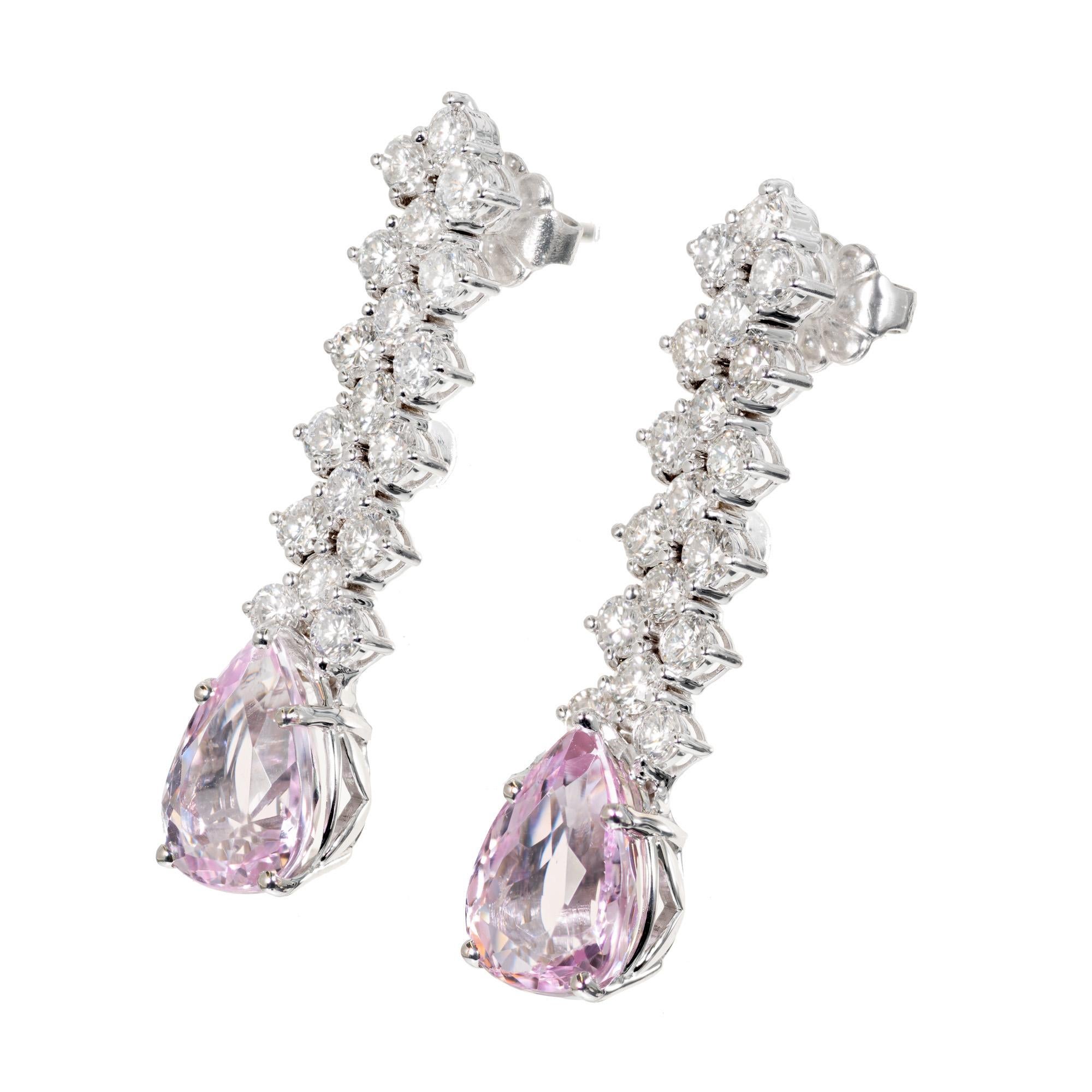 GIA Certified light pink topaz and diamond earrings. Flexible rows of bright white full cut diamonds and a matched pair of light pink pear shape topaz in 18k white gold 

1 pear shape light pink topaz VA, approx. 2.77cts GIA Certificate #