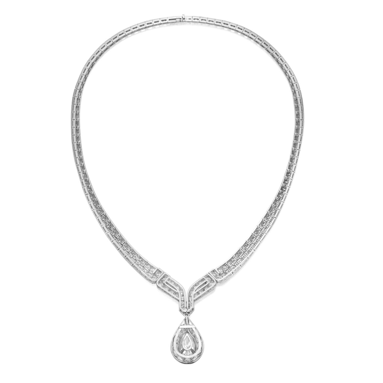 Exquisite Platinum Diamond Pendant Necklace
A breathtaking creation, this necklace features a detachable pendant showcasing a 5-carat, D-color, VS2 clarity pear-shaped diamond, GIA certified, elegantly framed by brilliant round diamonds. The