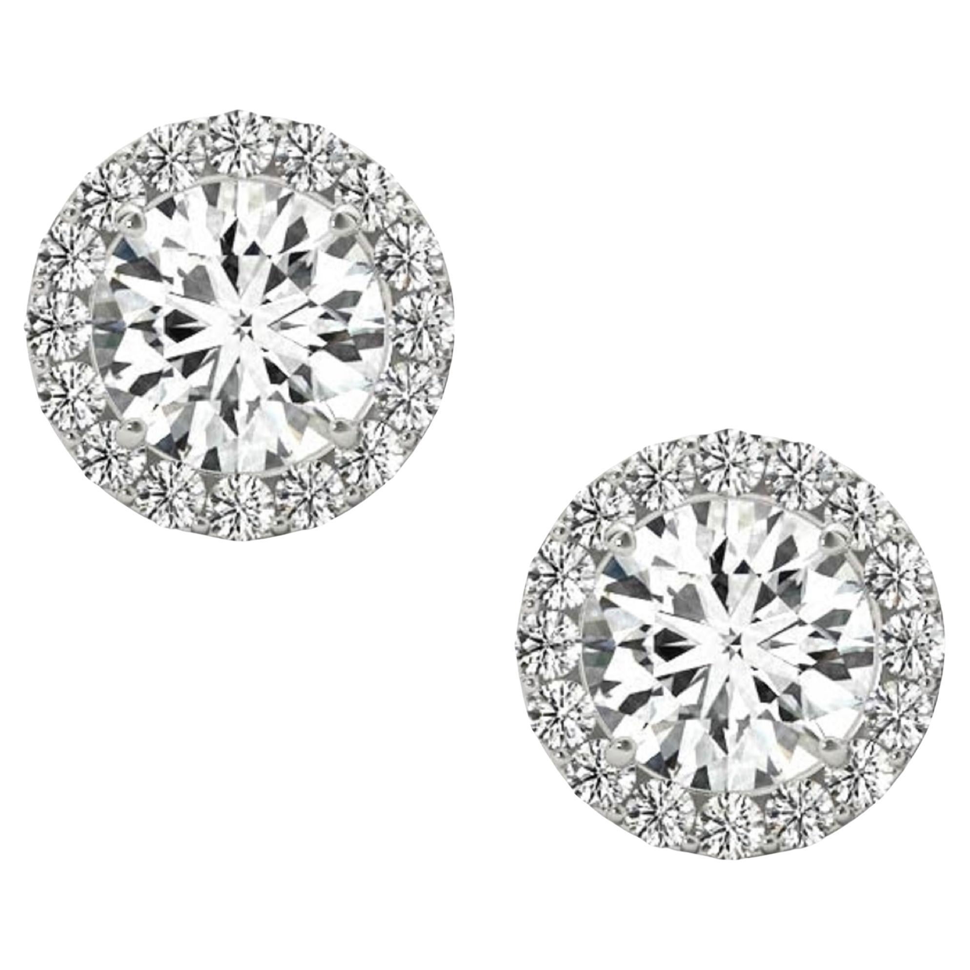 This stunning and impressively large 5.22 carat matched pair of round brilliant cut natural diamonds are very well cut, sparkle beautifully, and are offered at a remarkable value! They are 100% natural earth mined diamonds and have not received any