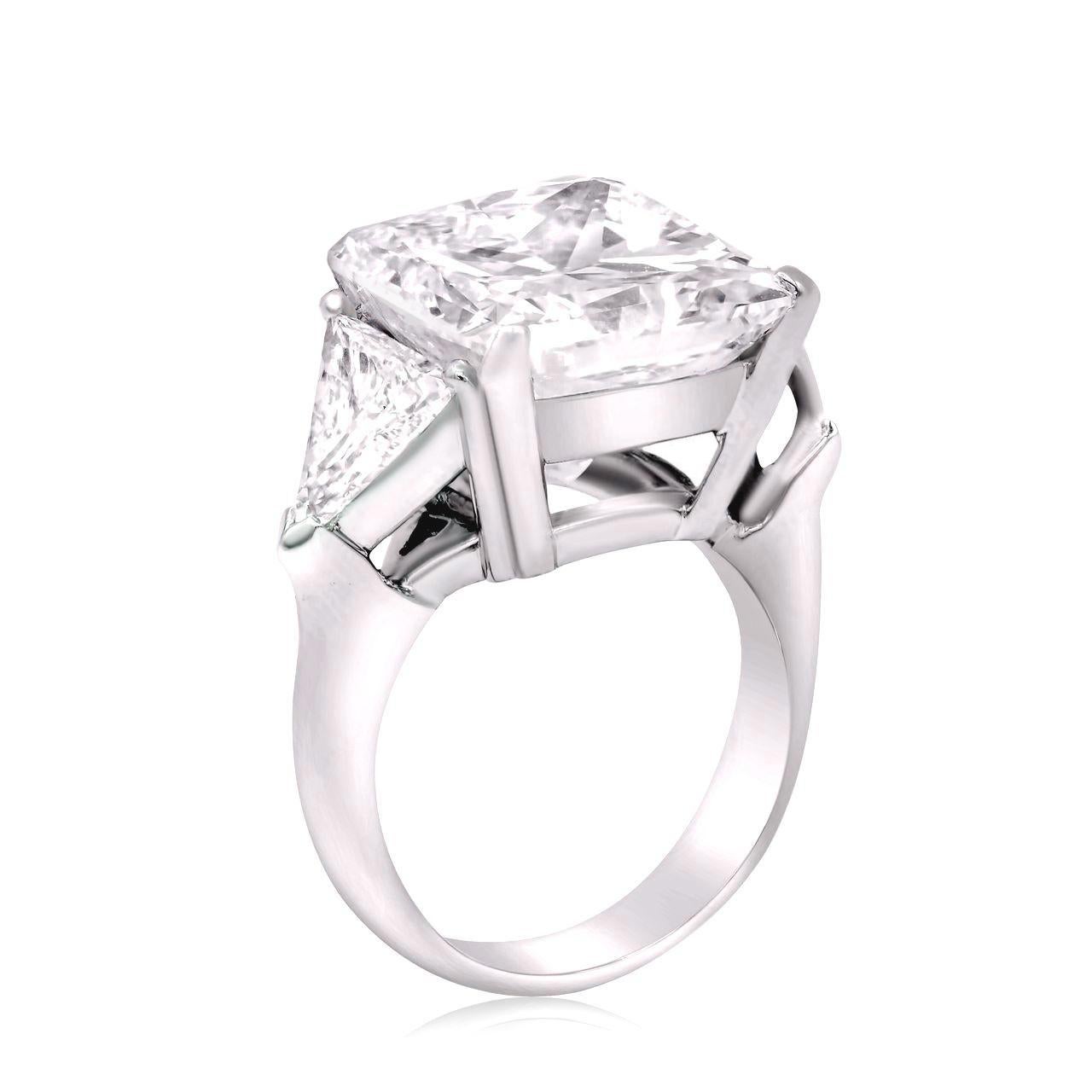 This elegant ring features a 5.01 carat princess cut diamond as its centerpiece, offering a modern and striking appearance. 

Certified by GIA, the diamond is graded H in color, exuding a soft, refined warmth that complements it's brilliance. The