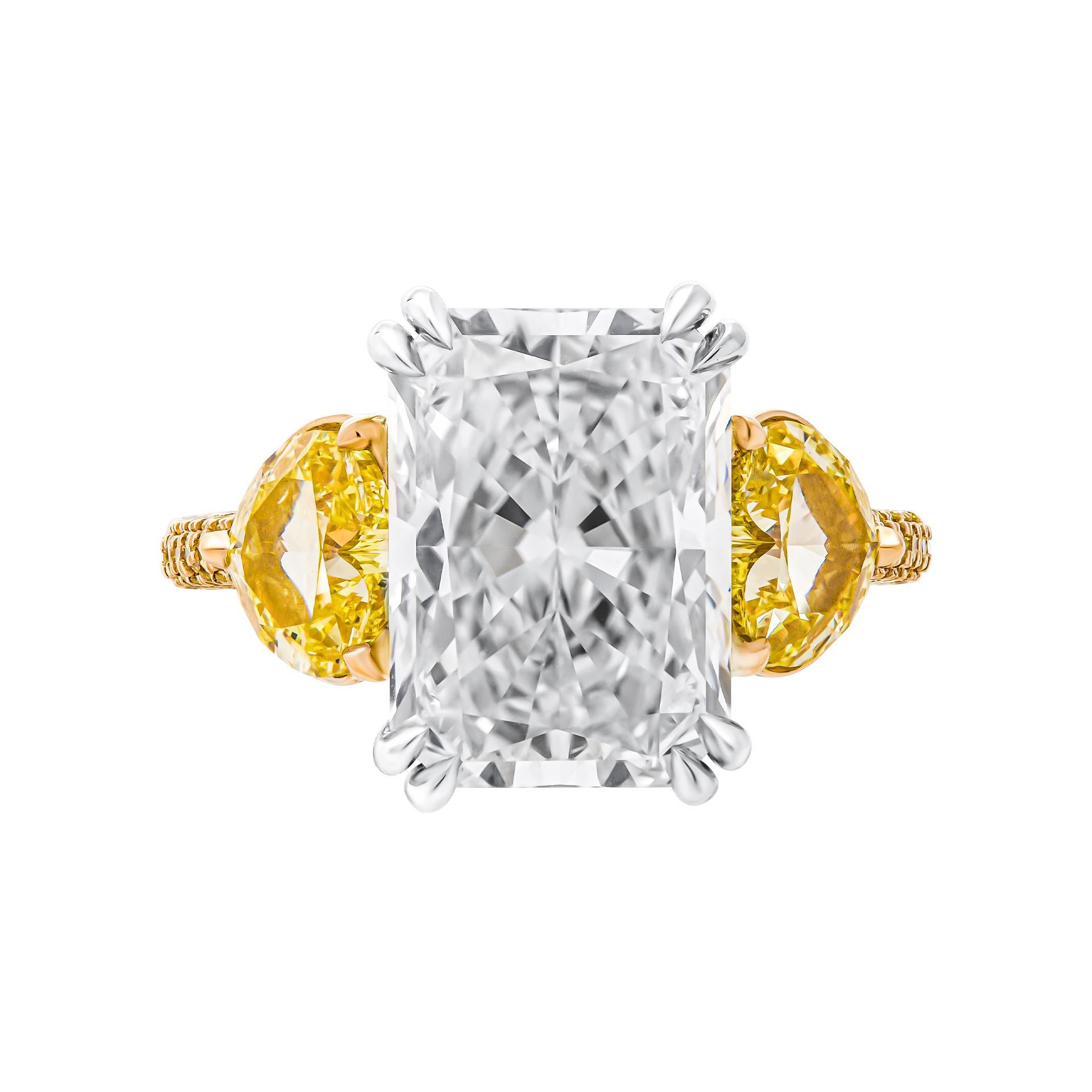 3 stone ring in 18K yellow Gold & PT950
 Center stone: 5.23ct J VVS1 Radiant Shape Diamond GIA#6224068959
 Side stones: 1.01ct Natural Fancy Intense Yellow VS1 GIA#7386744373 
                      1.00ct Natural Fancy Intense Yellow VVS2