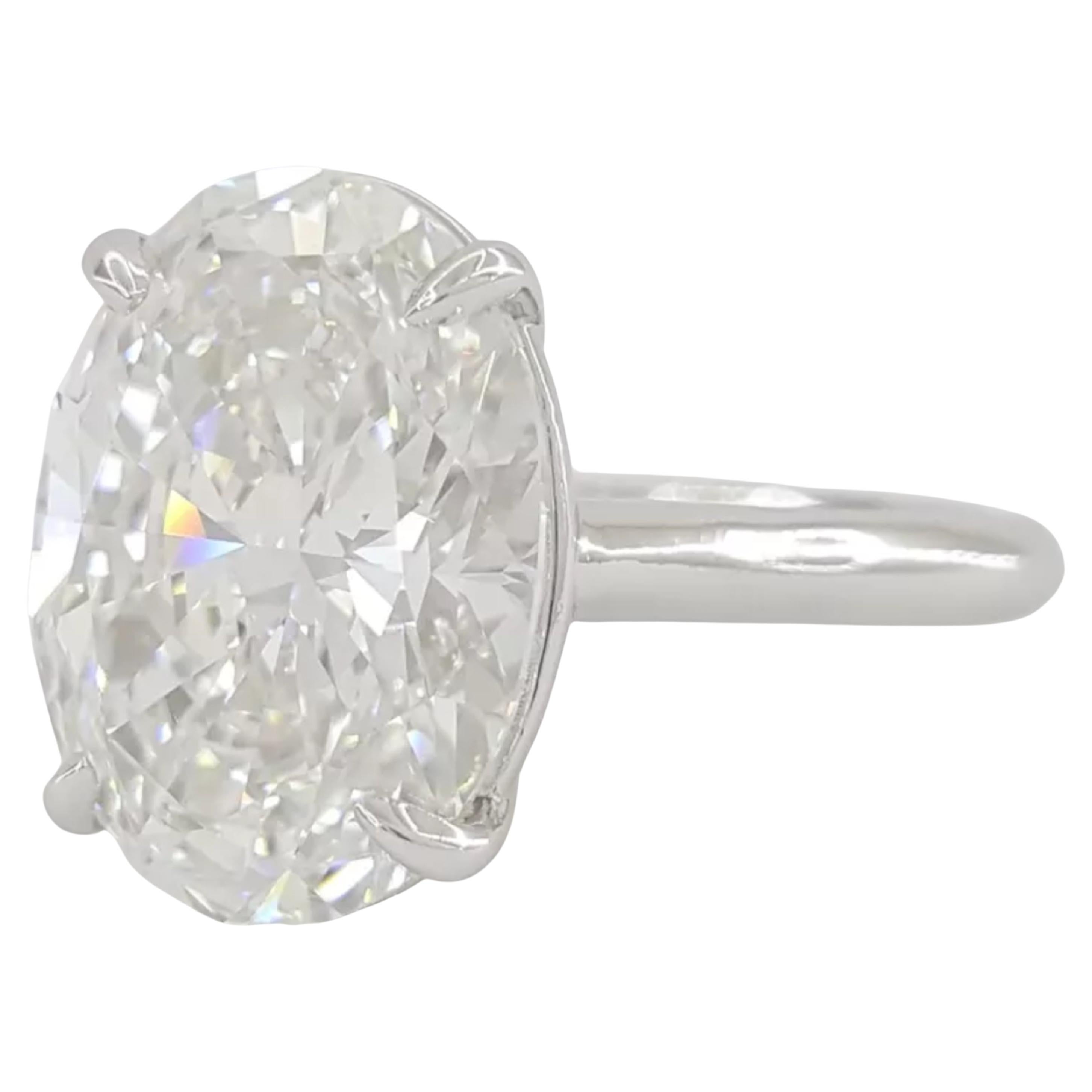 Contemporary GIA Certified 5.26 Carat Oval Cut Diamond Engagement Platinum Ring For Sale