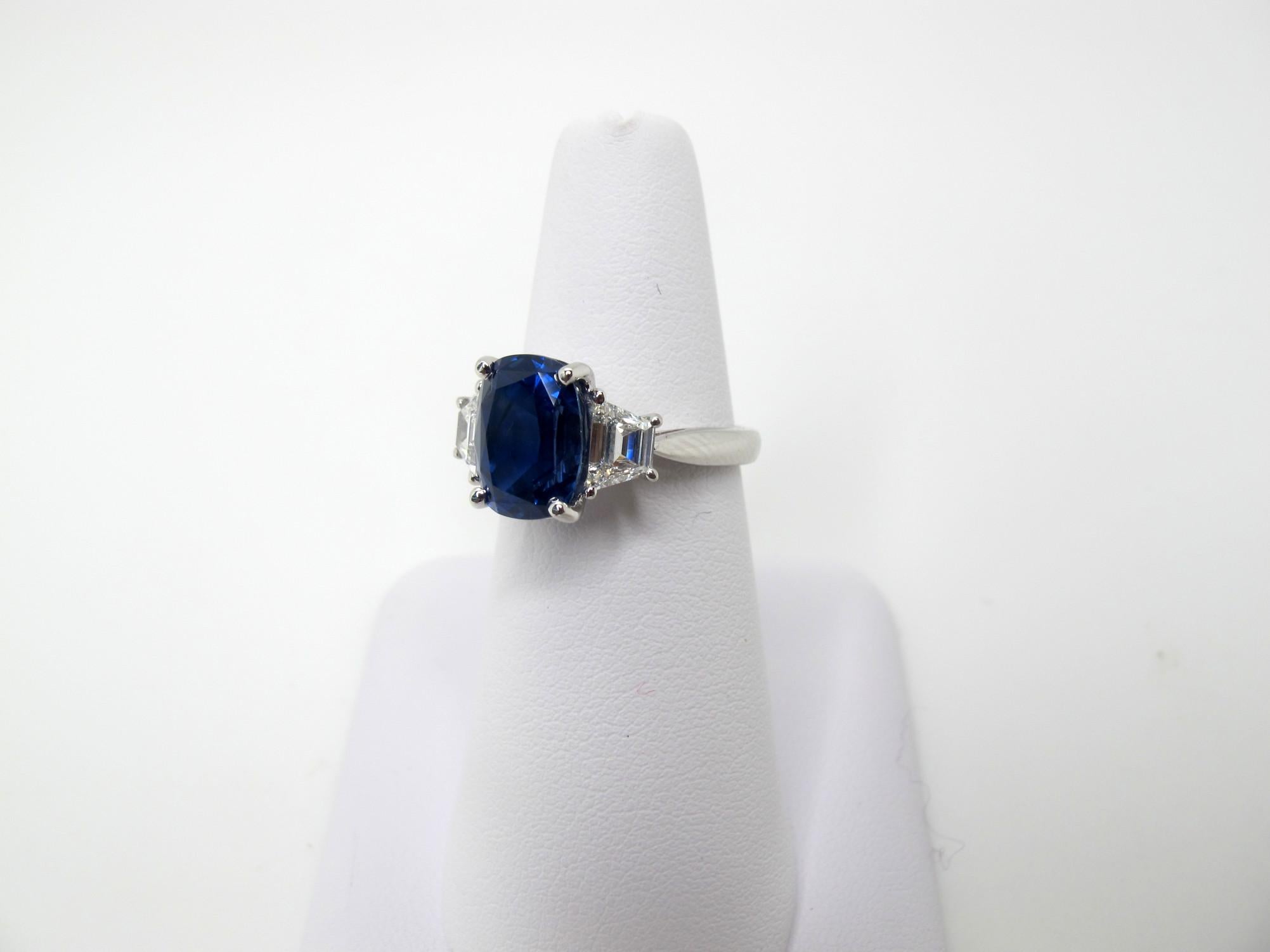 A rich, medium blue, gem quality sapphire that weighs 5.28 carats is featured in this ring. It is accompanied by Gemological Institute of America certificate #2151344955 which states that it is unheated and comes from Sri Lanka. The sapphire is
