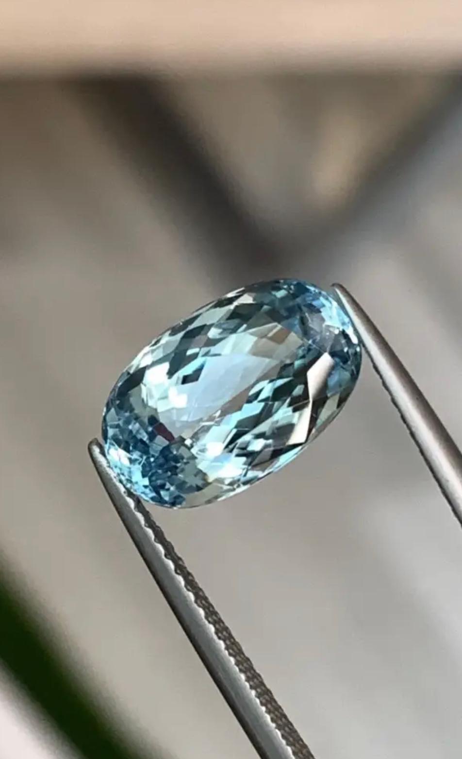 This exquisite 5.29ct Blue Paraiba Tourmaline is a true marvel of nature. Mined in Mozambique, this gem is a rare and captivating shade of blue. The stunning oval cut highlights the gem's exceptional colour and maximizes its brilliance and fire,